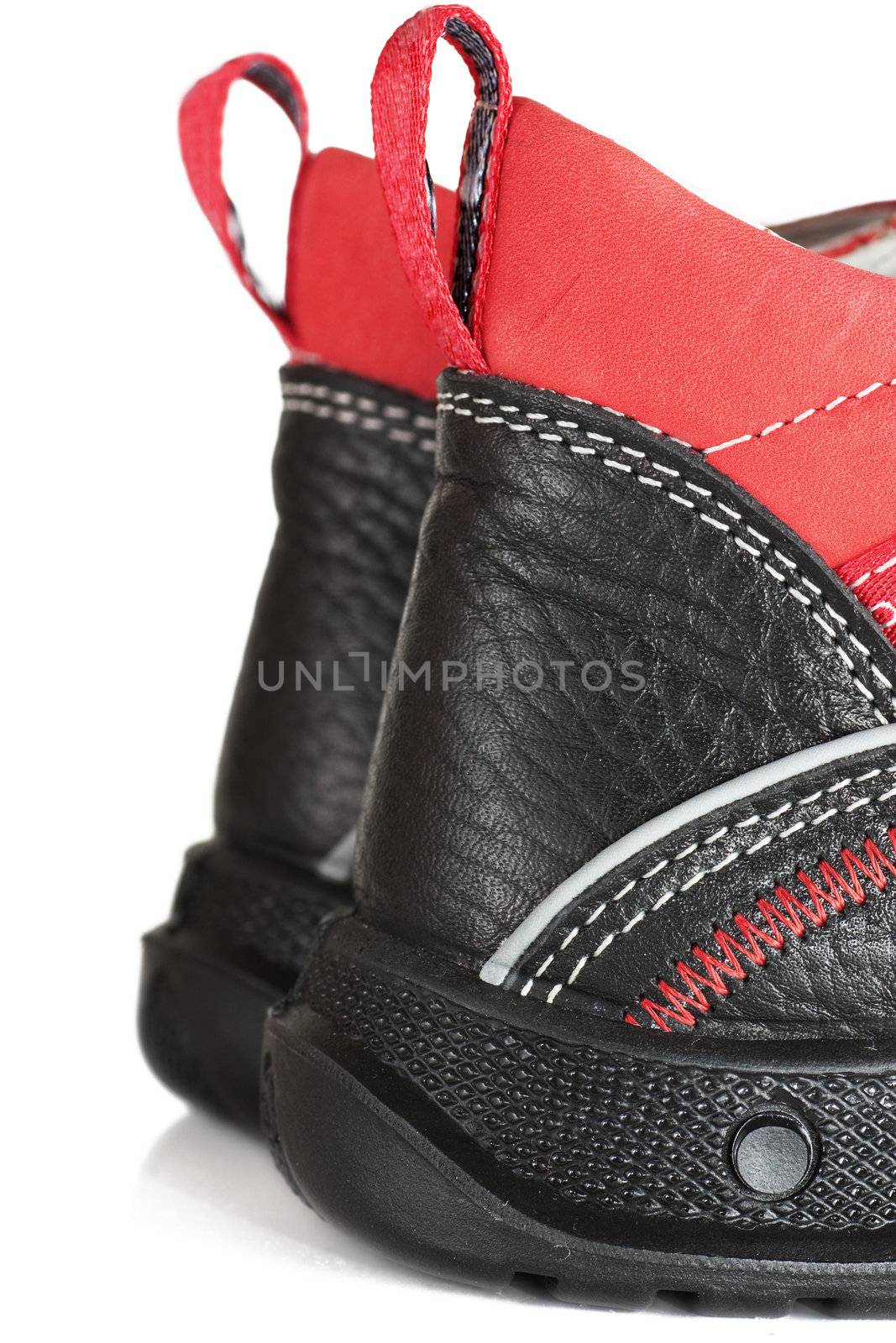 Pair of child shoes isolated over white background. Detailed veiw.