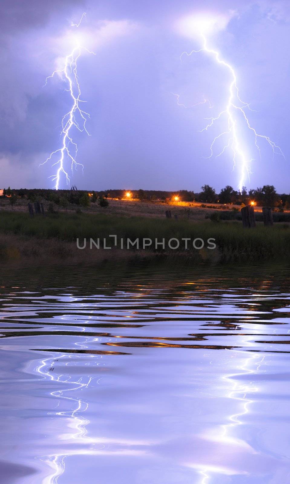 thunderstorm with lightnings and cloudy sky at rainy night