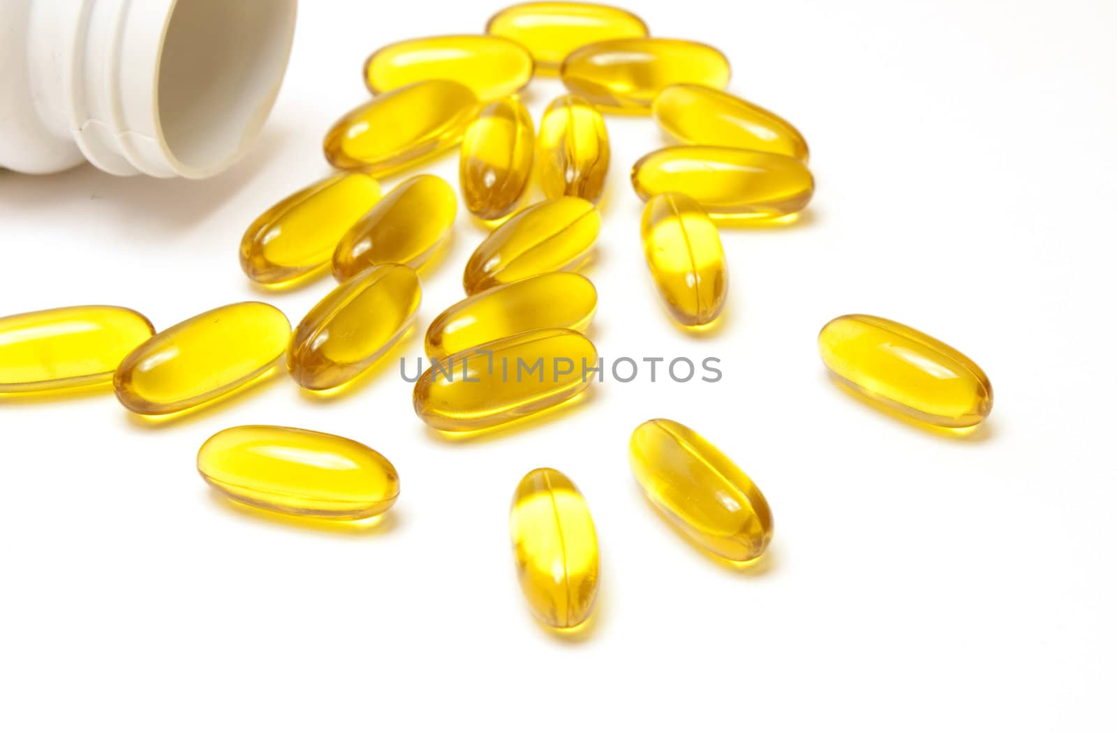 Yellow vitamin pills by Arsen