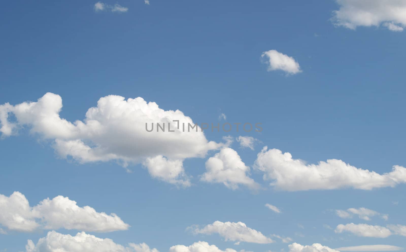 Blue sky with white clouds useful as a background