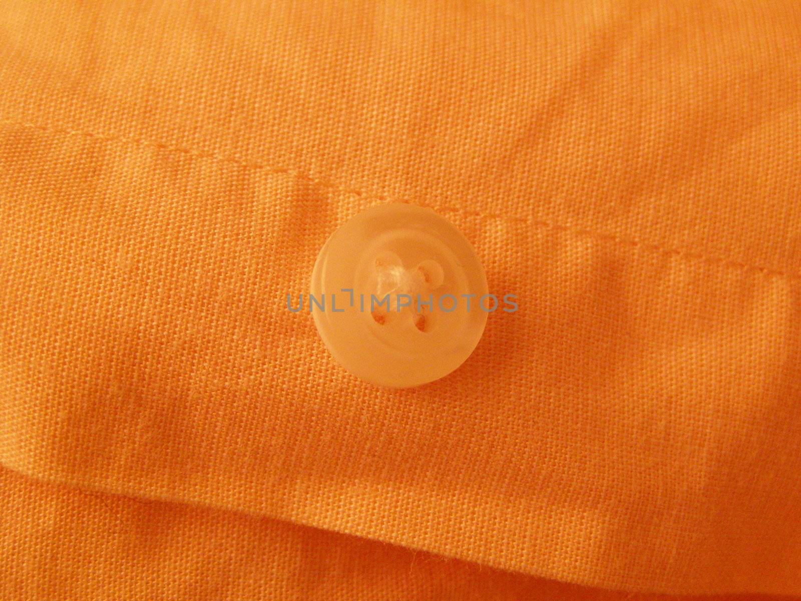 shirt button over orange shirt