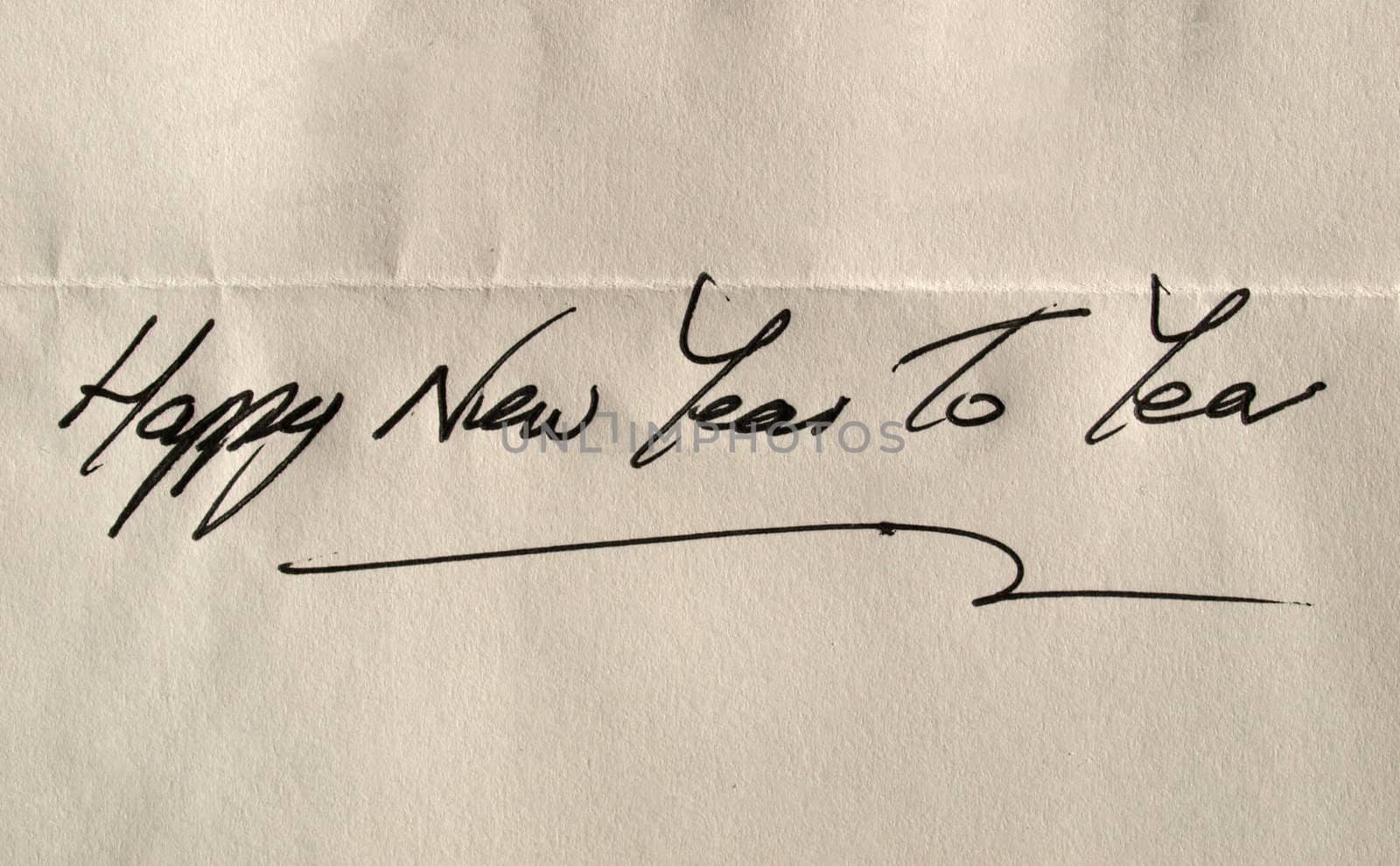 Happy new year to you handwritten in elegant English characters