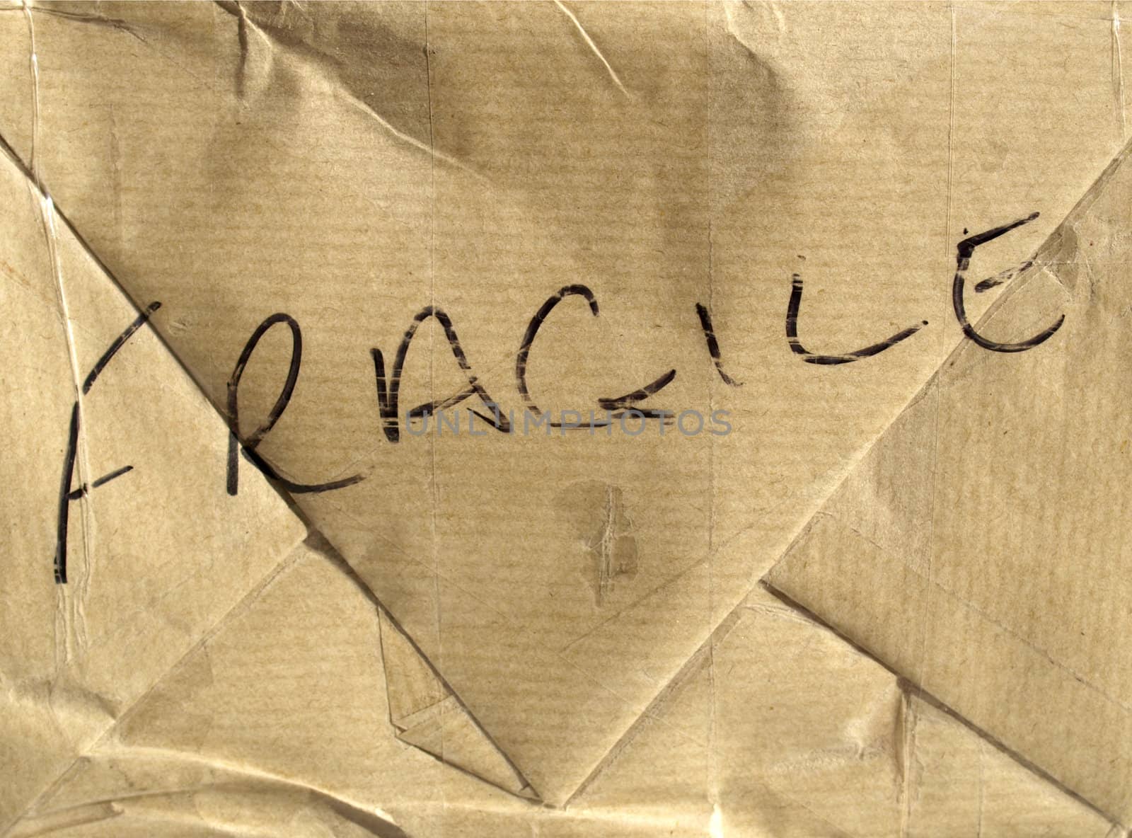 Fragile brown corrugated cardboard packet