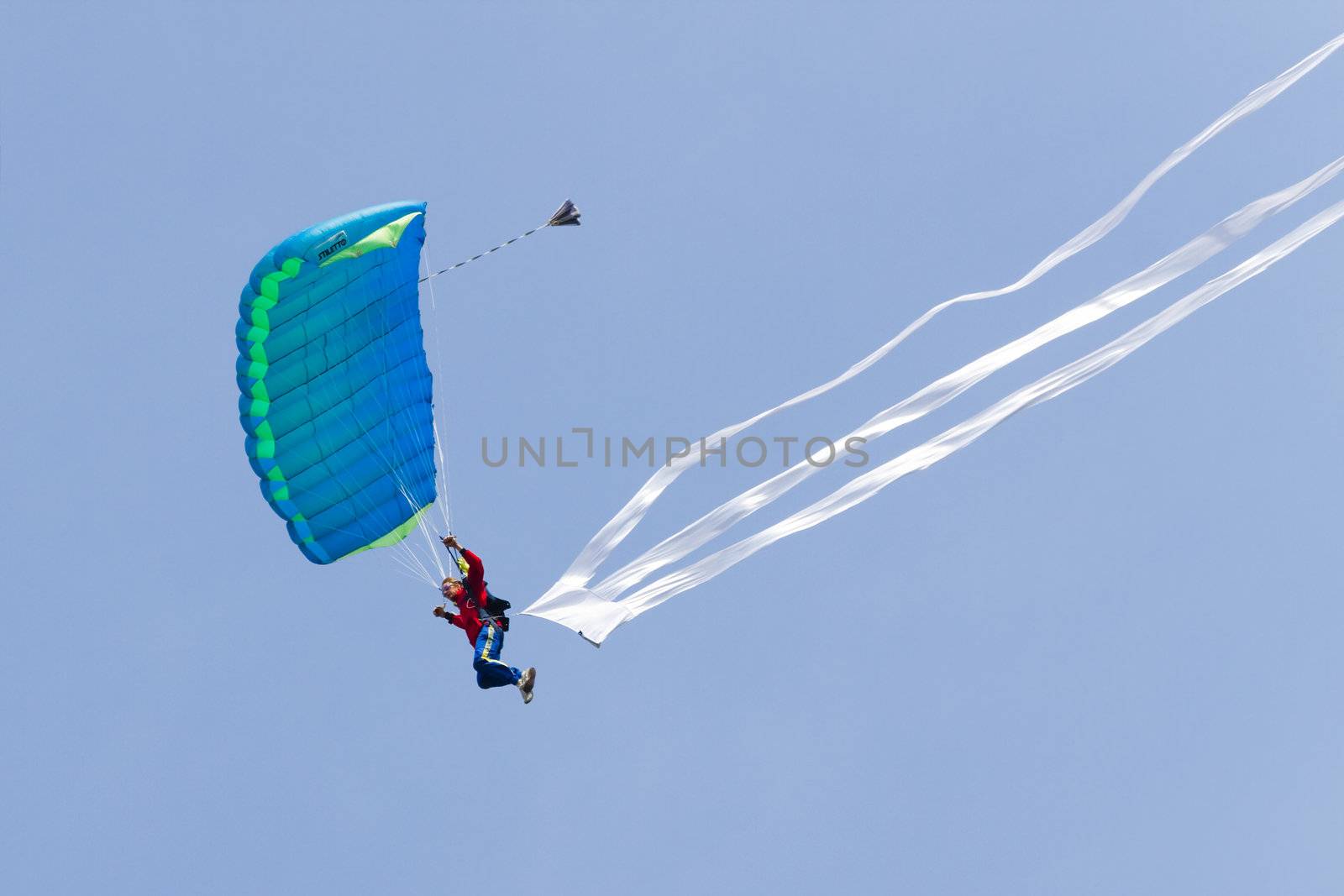 Parachutists demonstrate jumping from airplane by Colette