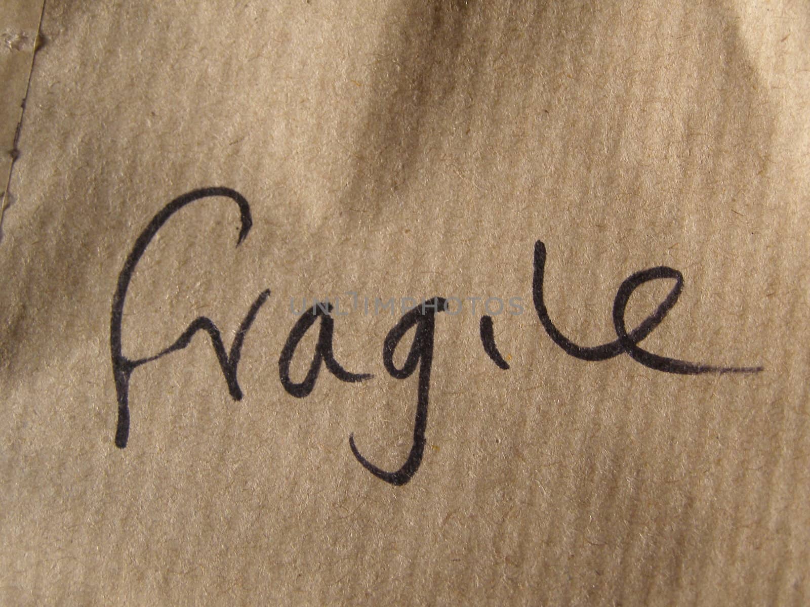 Fragile brown corrugated cardboard packet