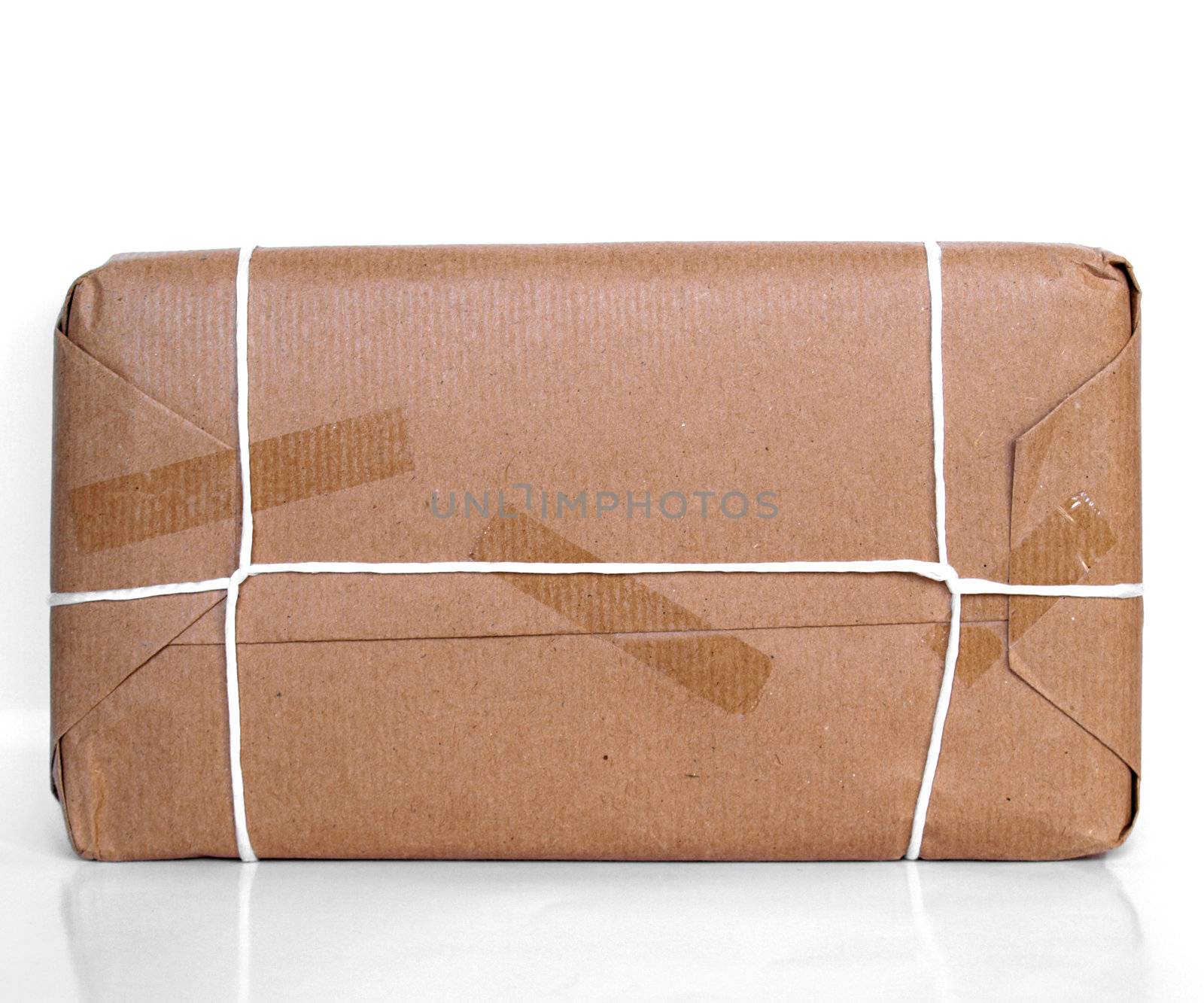 Parcel packet over a white background with reflection