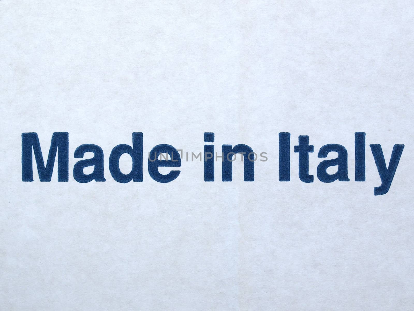 MADE IN ITALY printed on a corrugated cardboard carton background