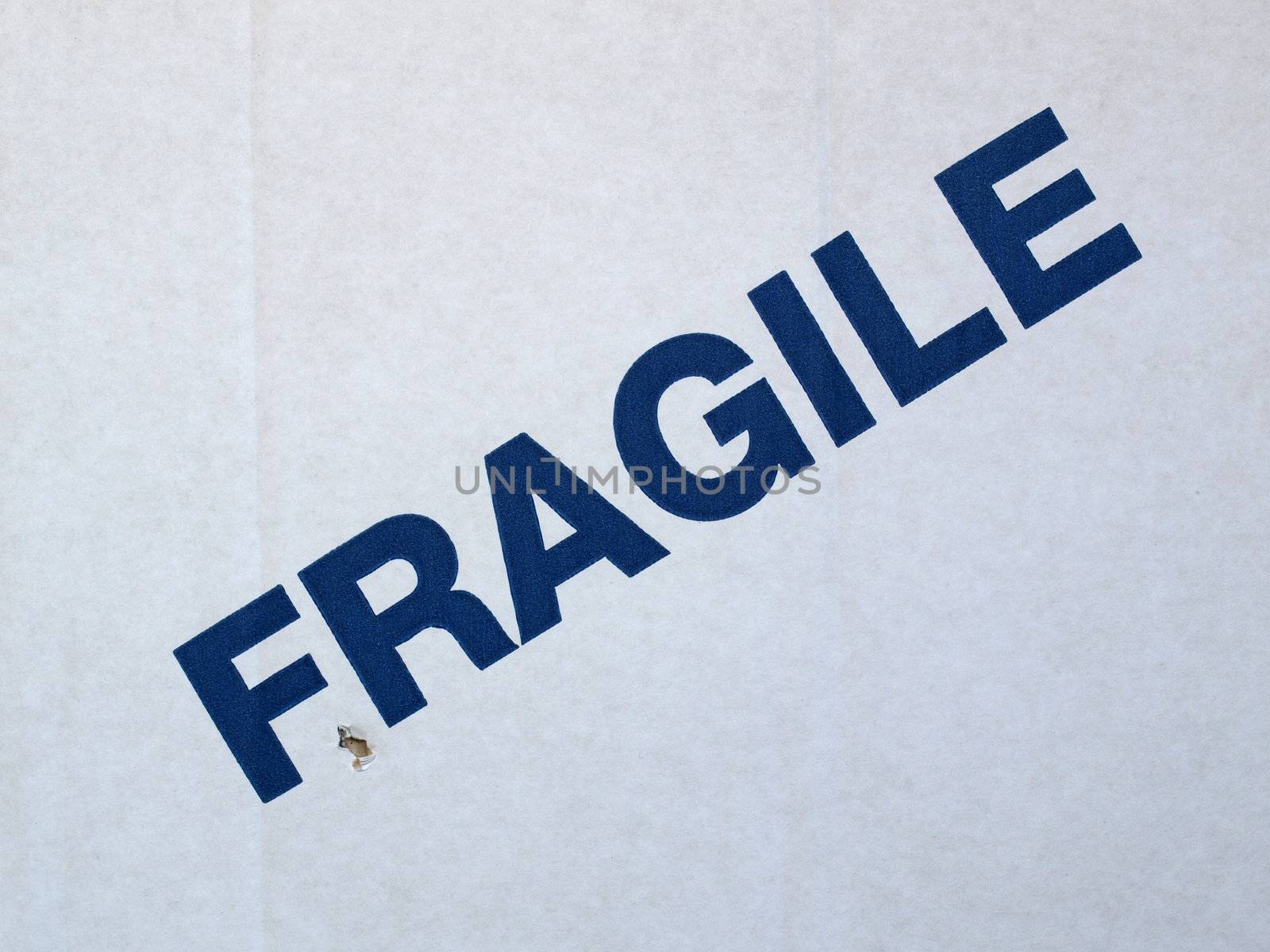 Fragile warning sign on a cardboard box for shipping