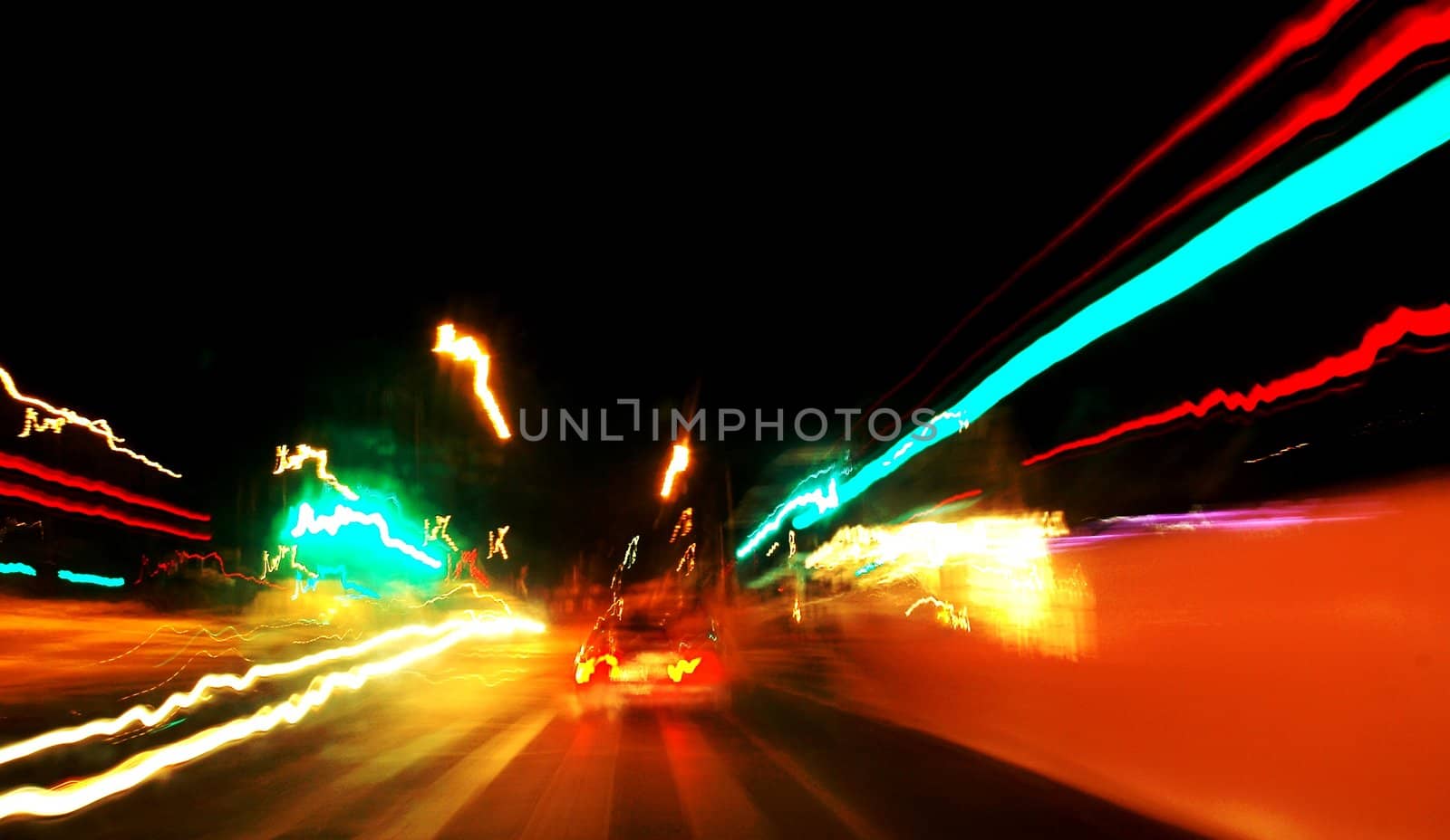 Slow shutter car driving at nighttime