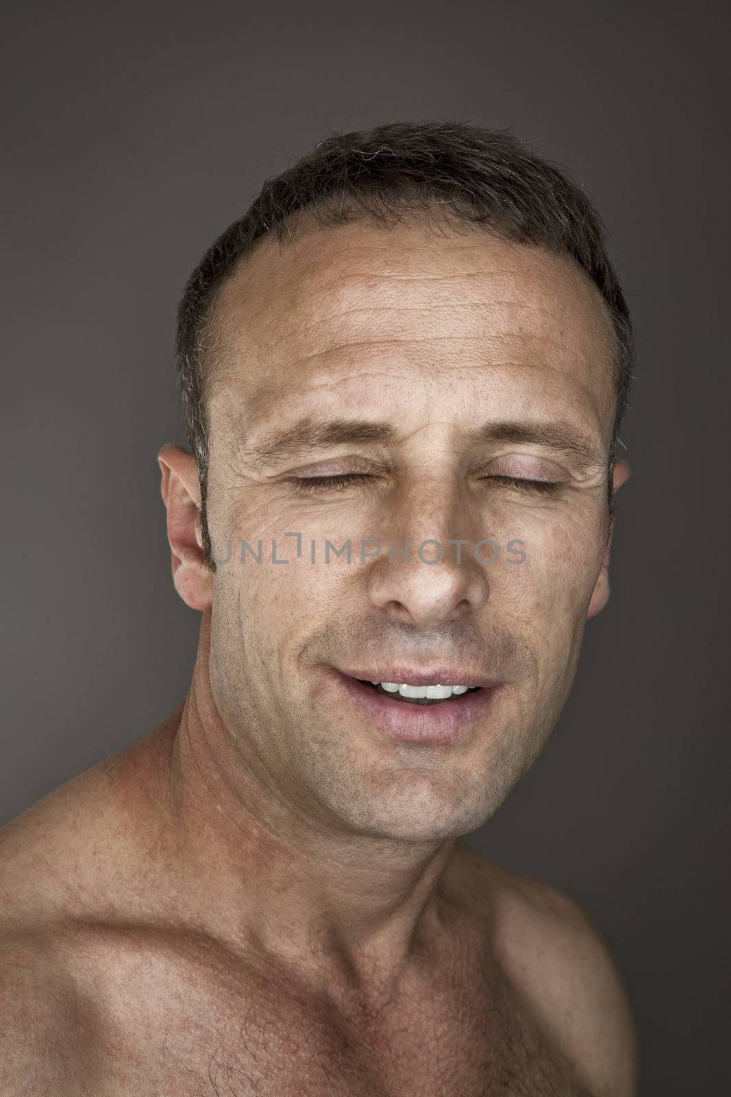An image of a handsome man with closed eyes