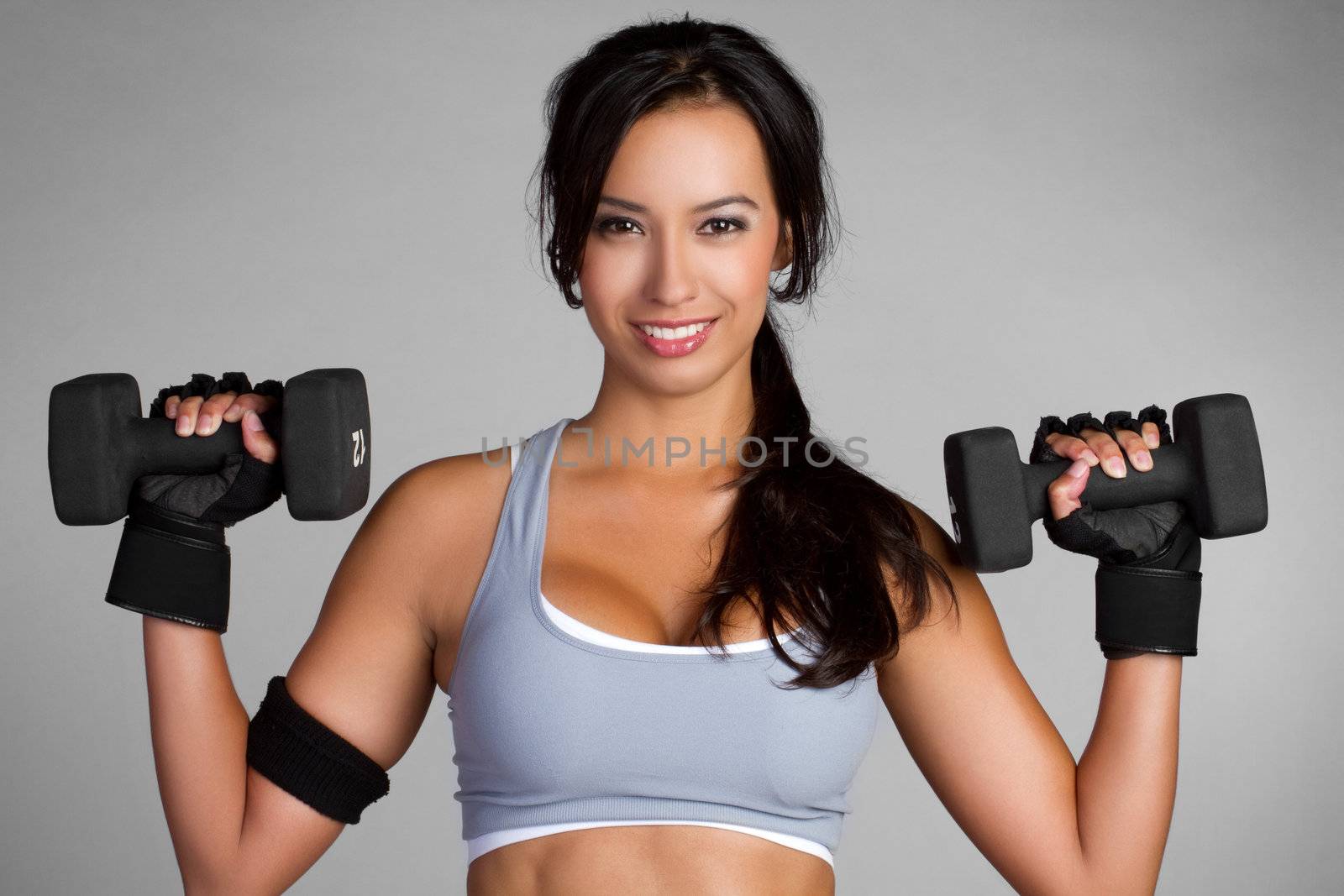 Beautiful latin woman lifting weights