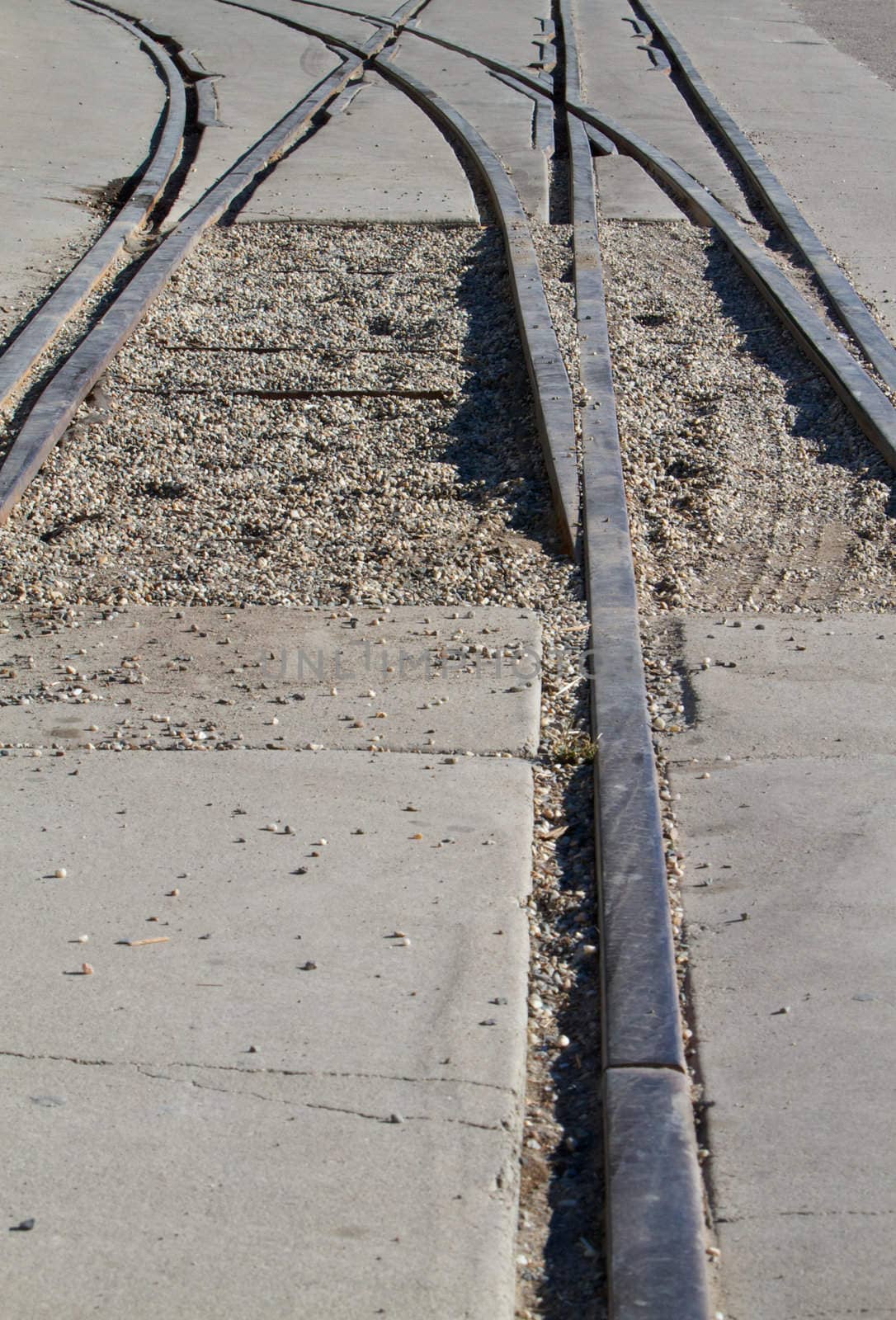 Abstract of railroad tracks with curve in distance