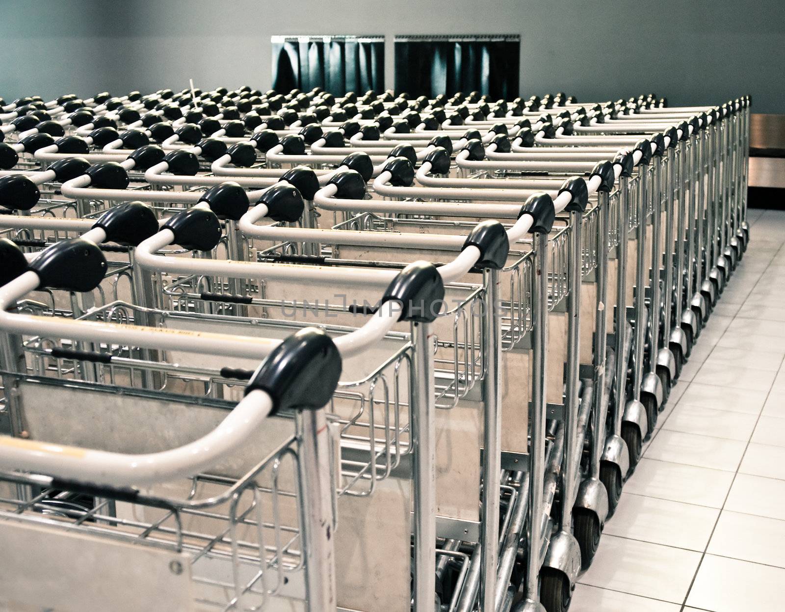 Row of baggage trolleys at an airport