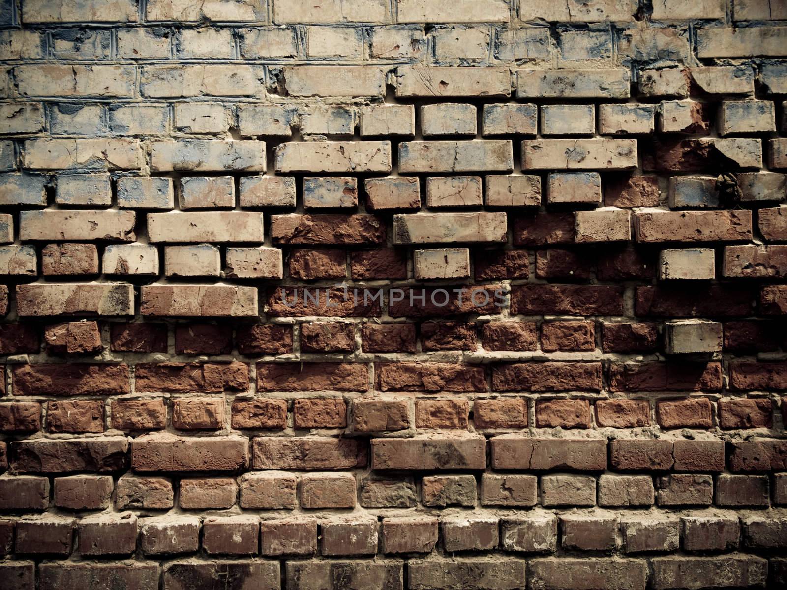 Crumbling old brick wall background