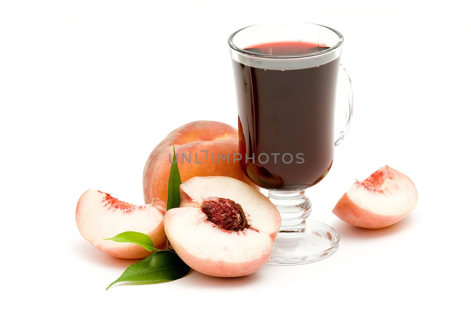 glass of fruit juice and peaches isolated on white 