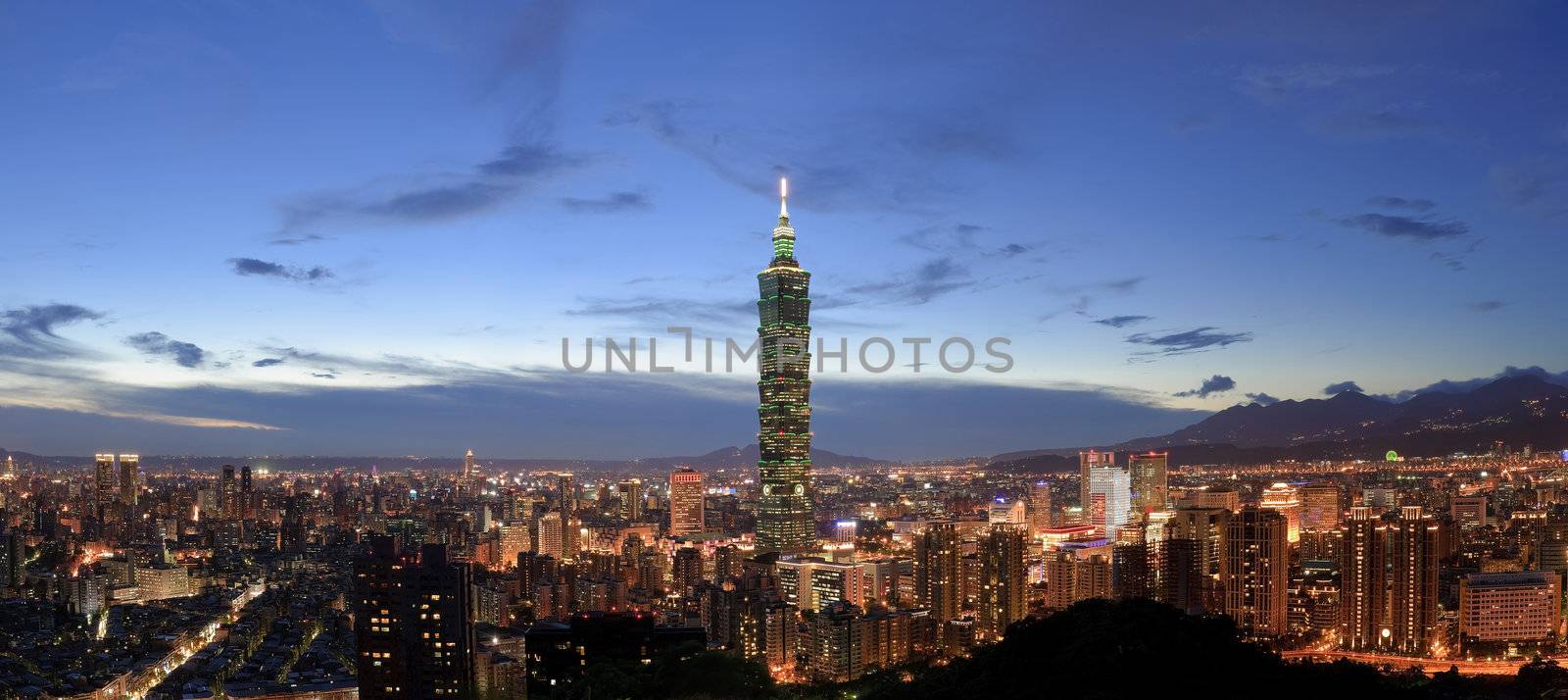 Panoramic city skyline in night with famous 101 skyscraper and buildings in Taipei, Taiwan.