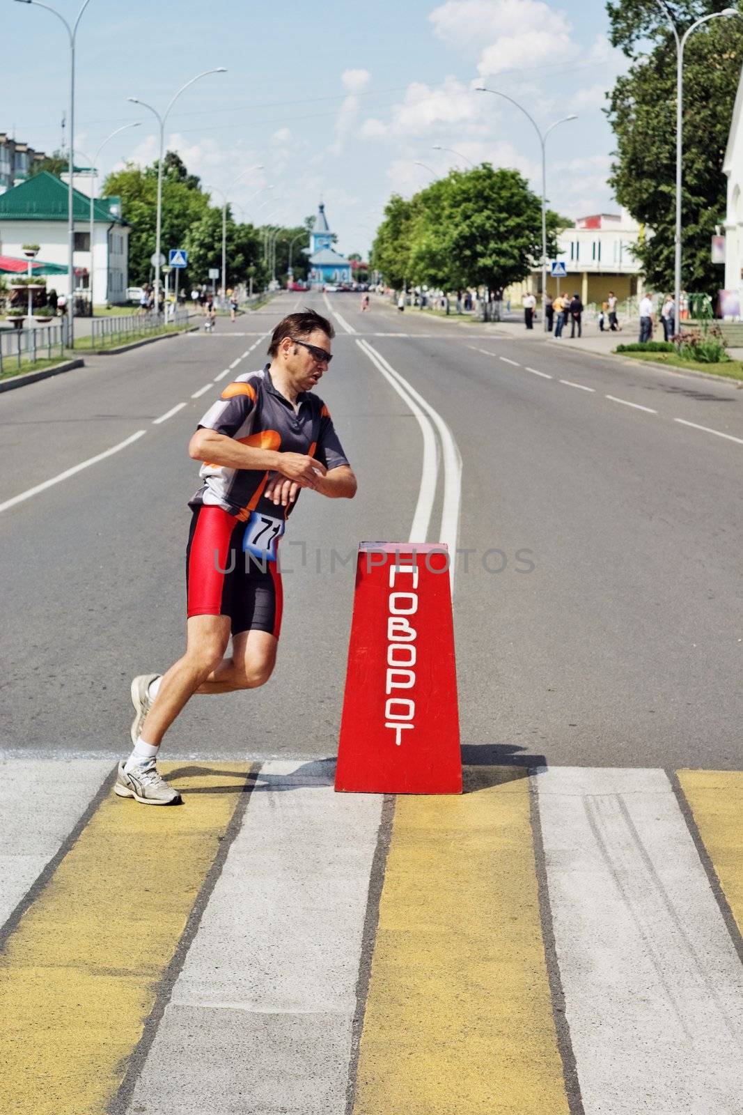 triathlon running athlet on town street sprint