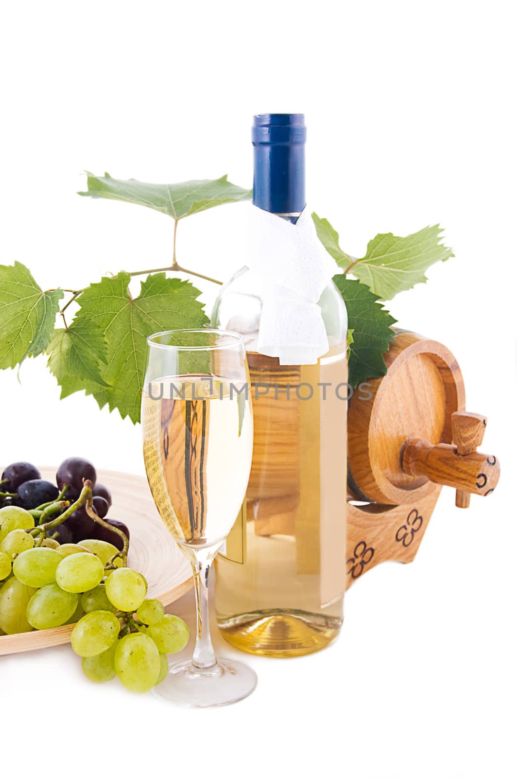 White wine bottle, glass and cask with grapes over white