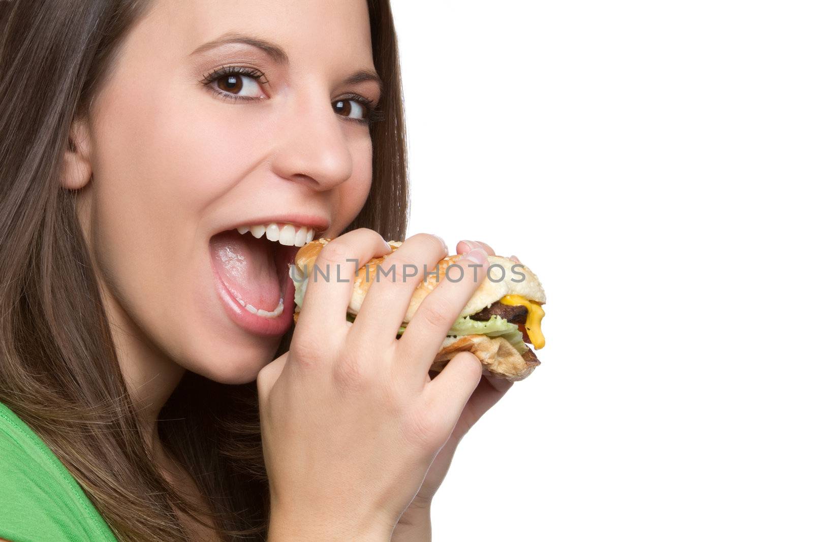 Beautiful young woman eating hamburger