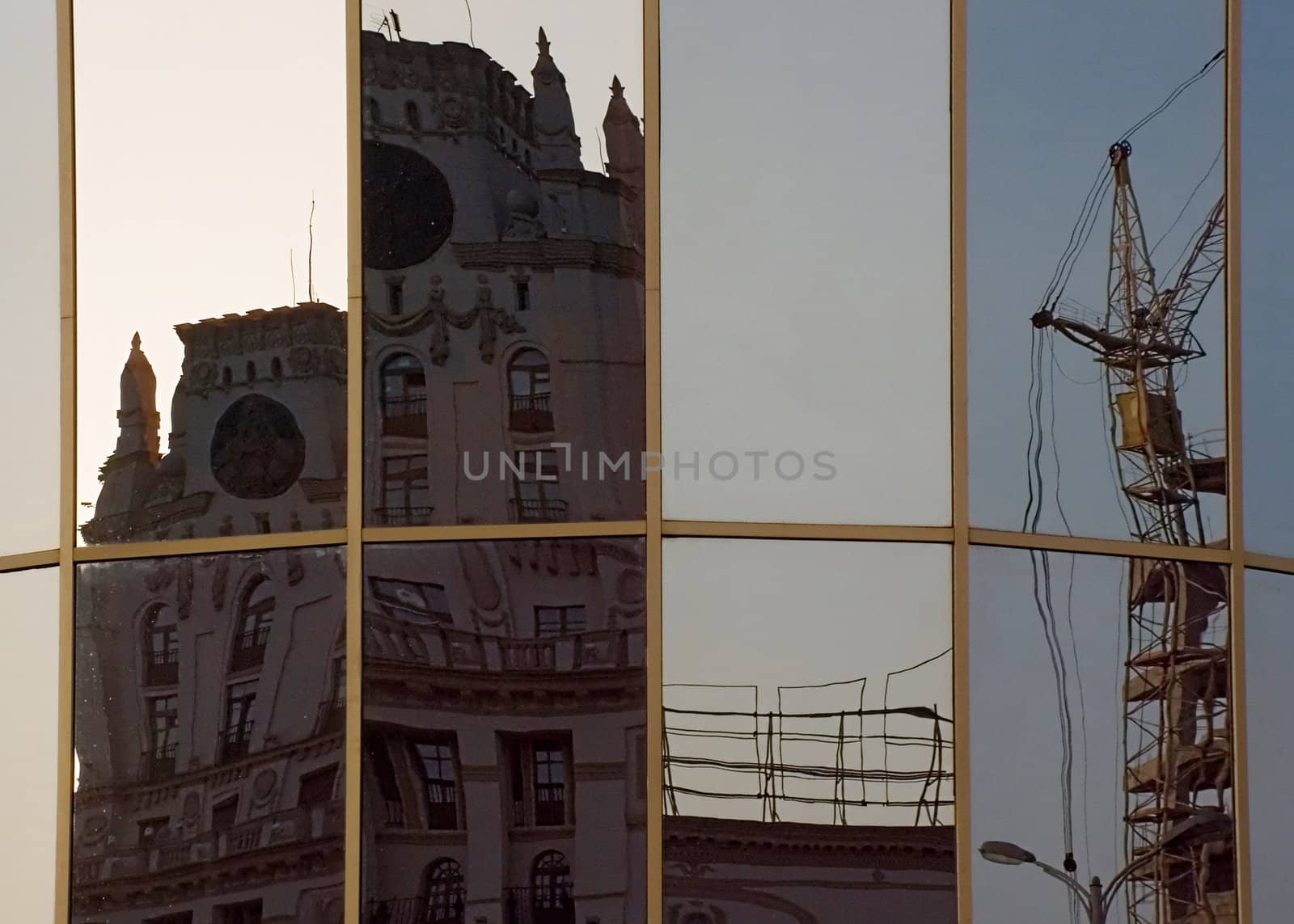 In glass of the station square buildings of Minsk city are reflected