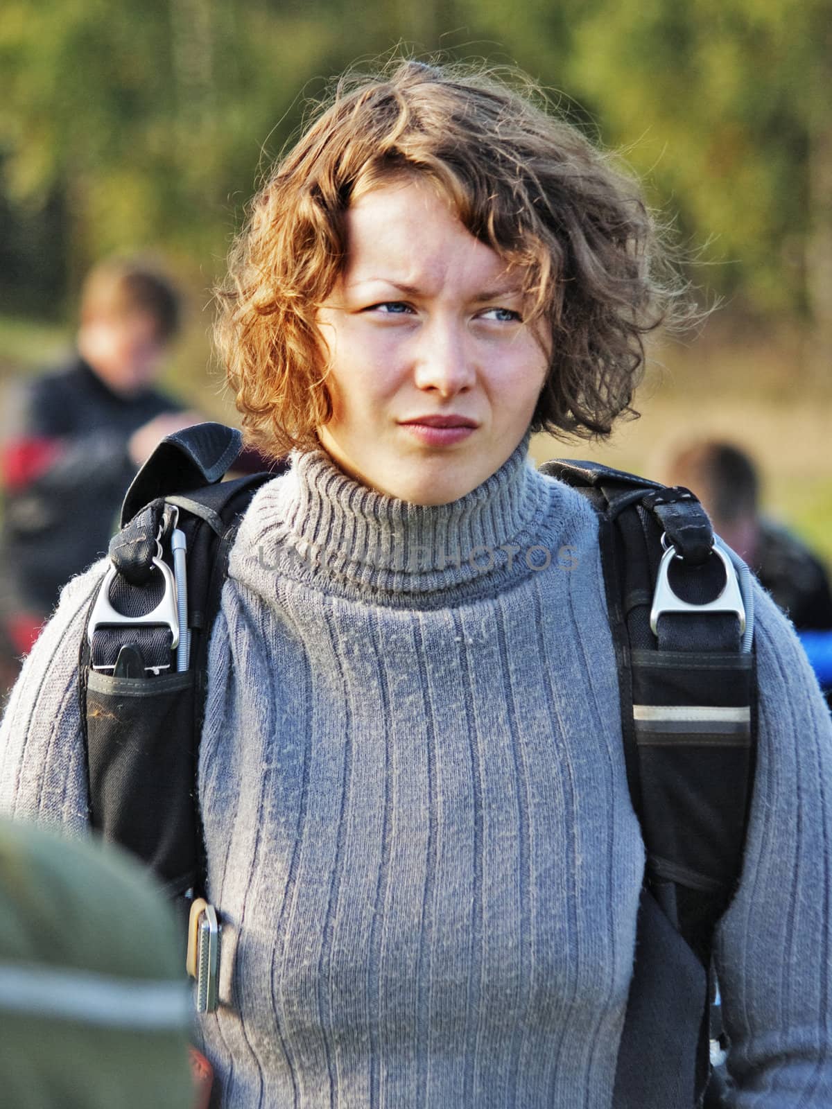 The girl-parachutist in a grey sweater