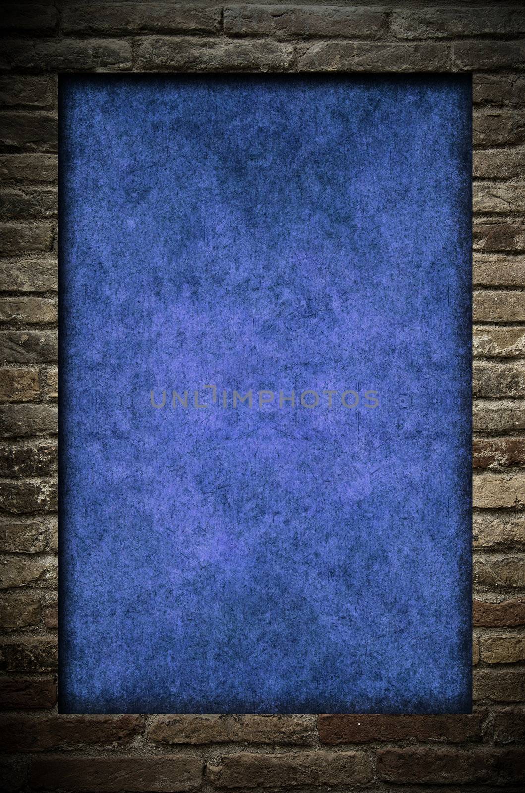 Grunge blue paper in a brick wall frame