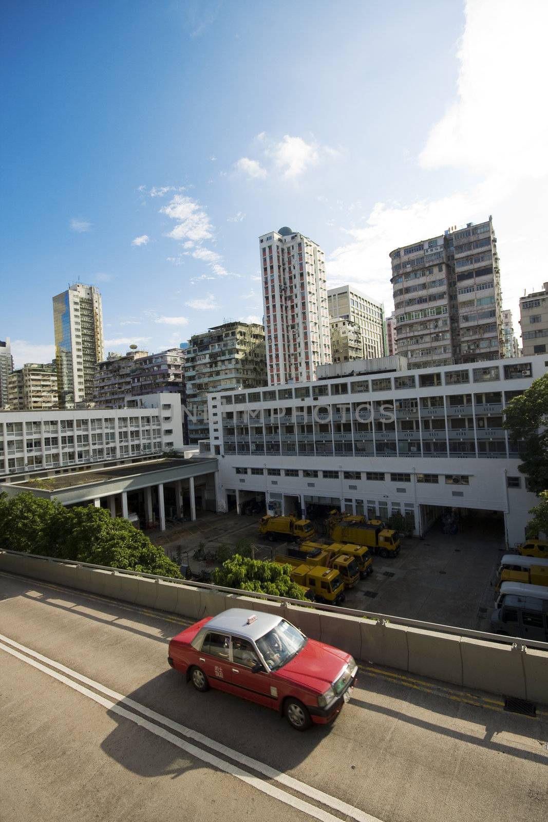 taxi passing the road in city at day