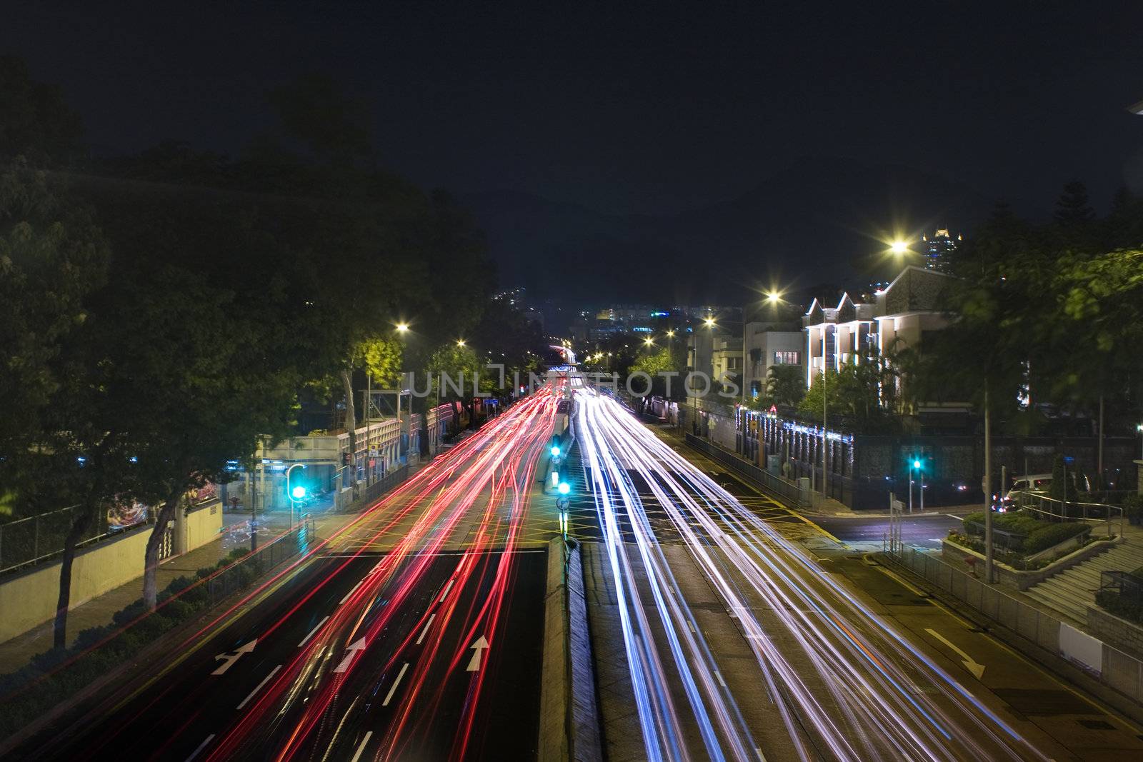 traffic in city at night with long car light