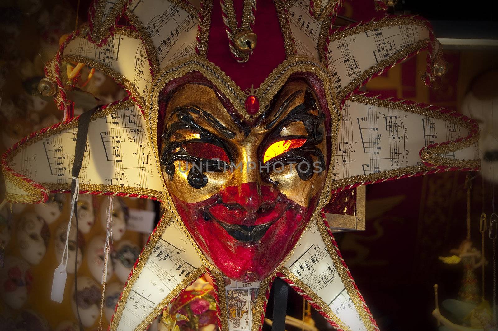 A white and red carnival mask of Venice