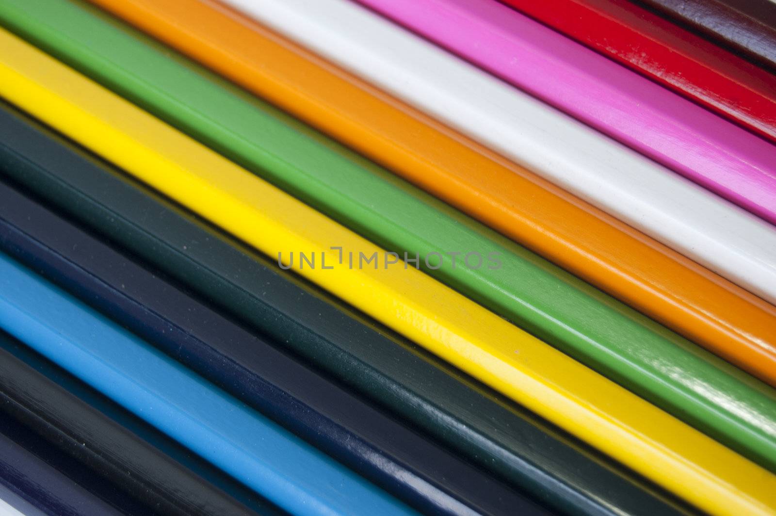 Close up of many colored pencils isolated