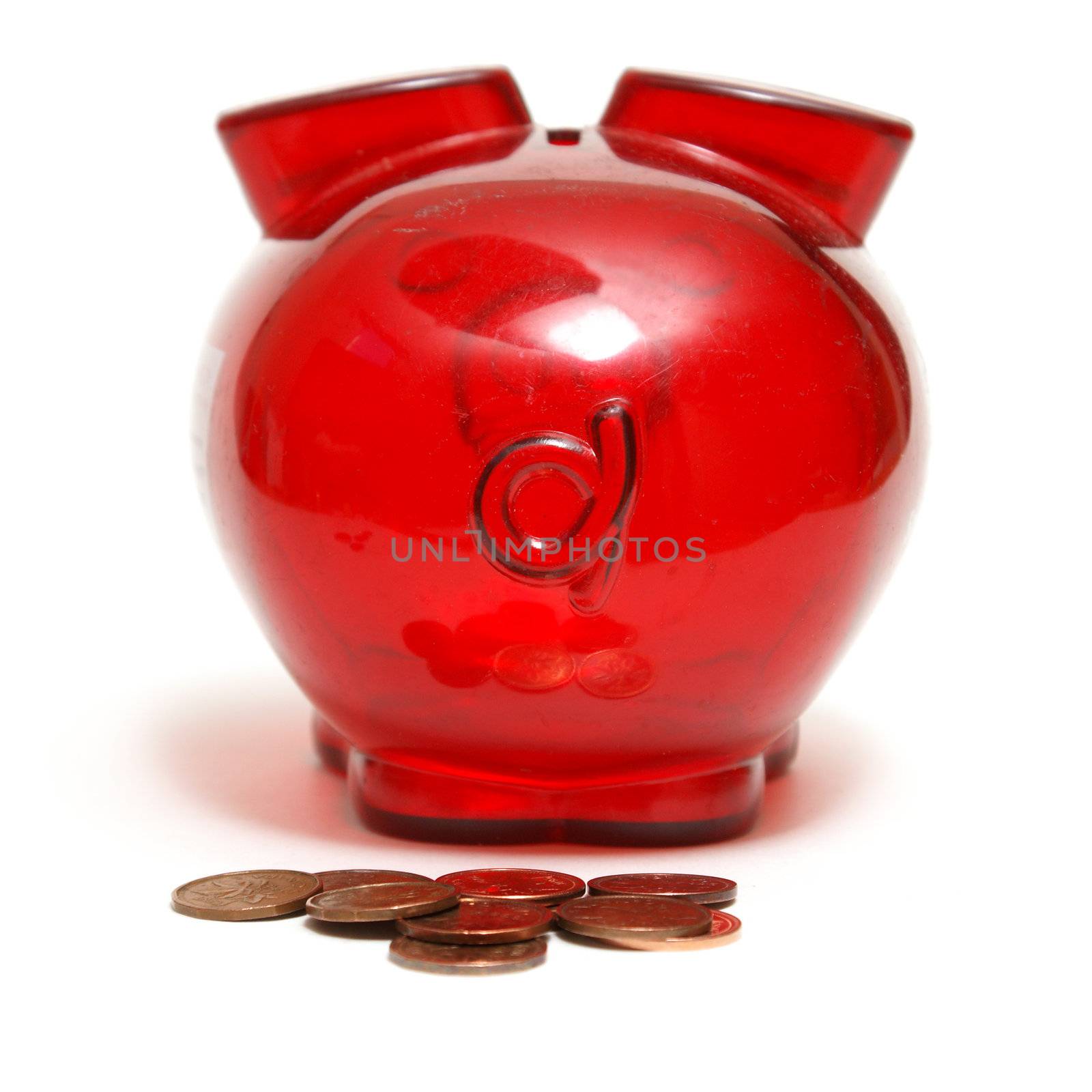 A piggy bank as made some droppings in the form of pennies.