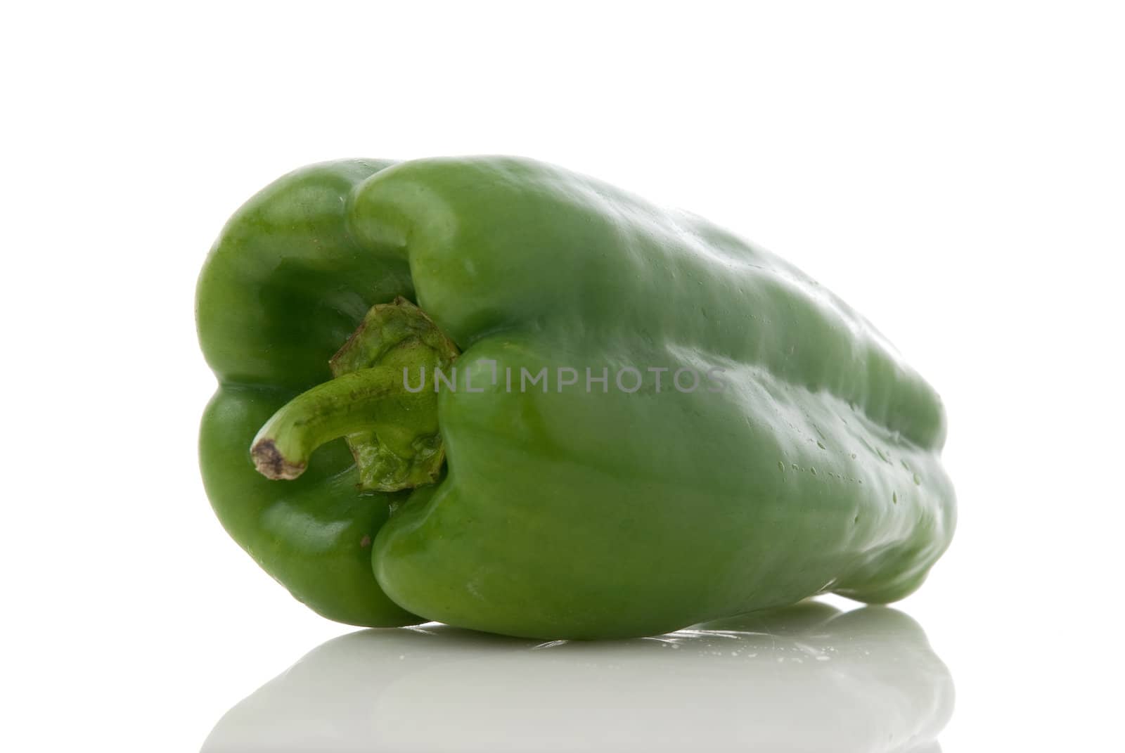 Green pepper on white background.