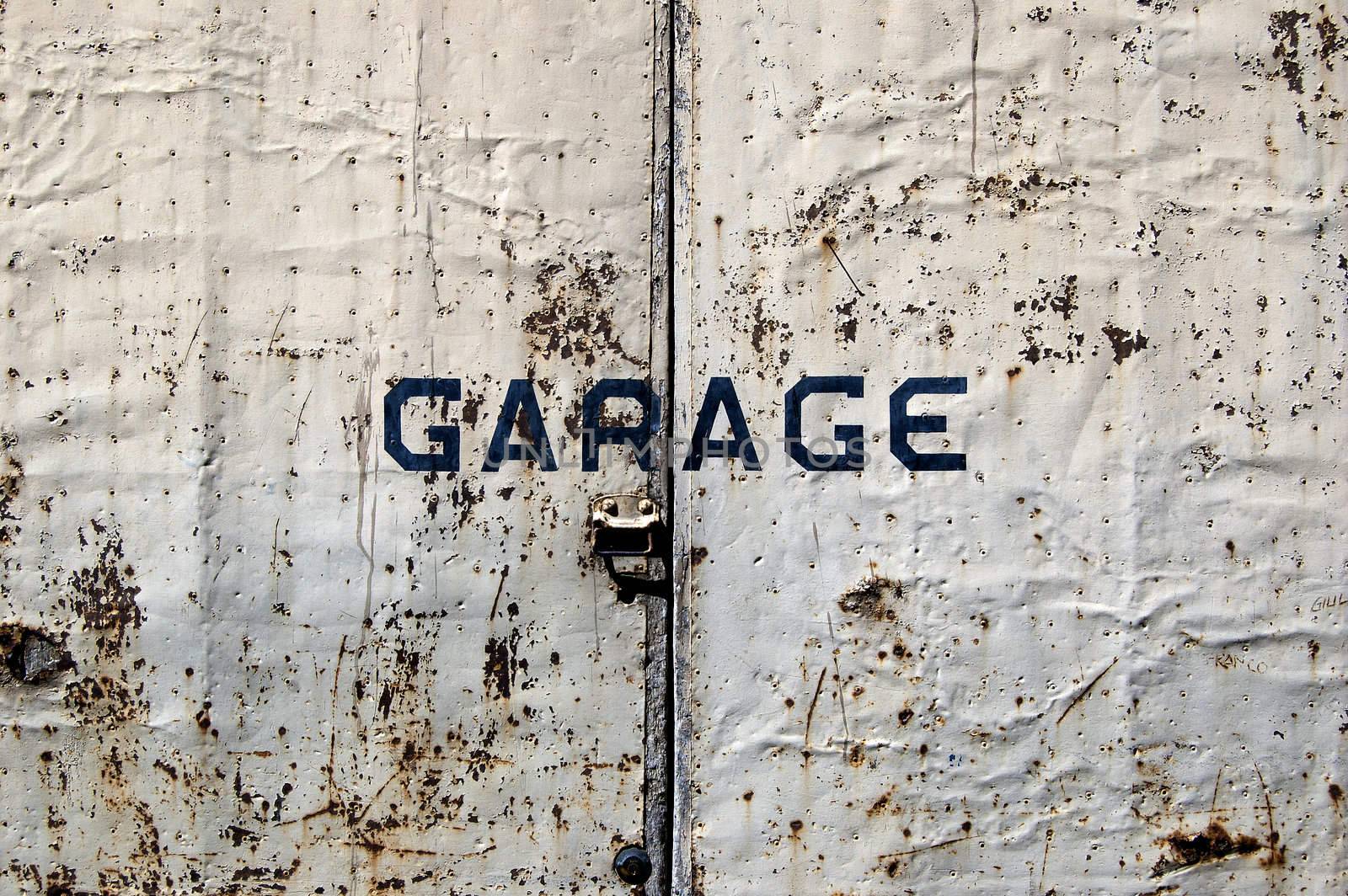 A rusted old door of a garage