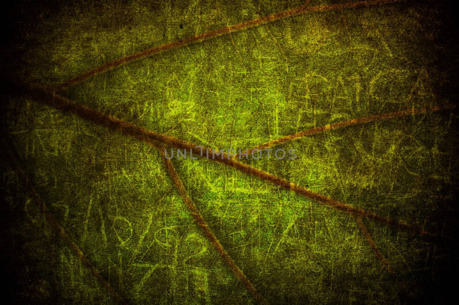 A texture with a green grunge leaf