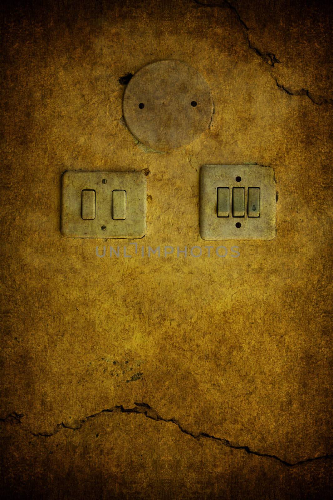 A yellow grunge concrete background with switch