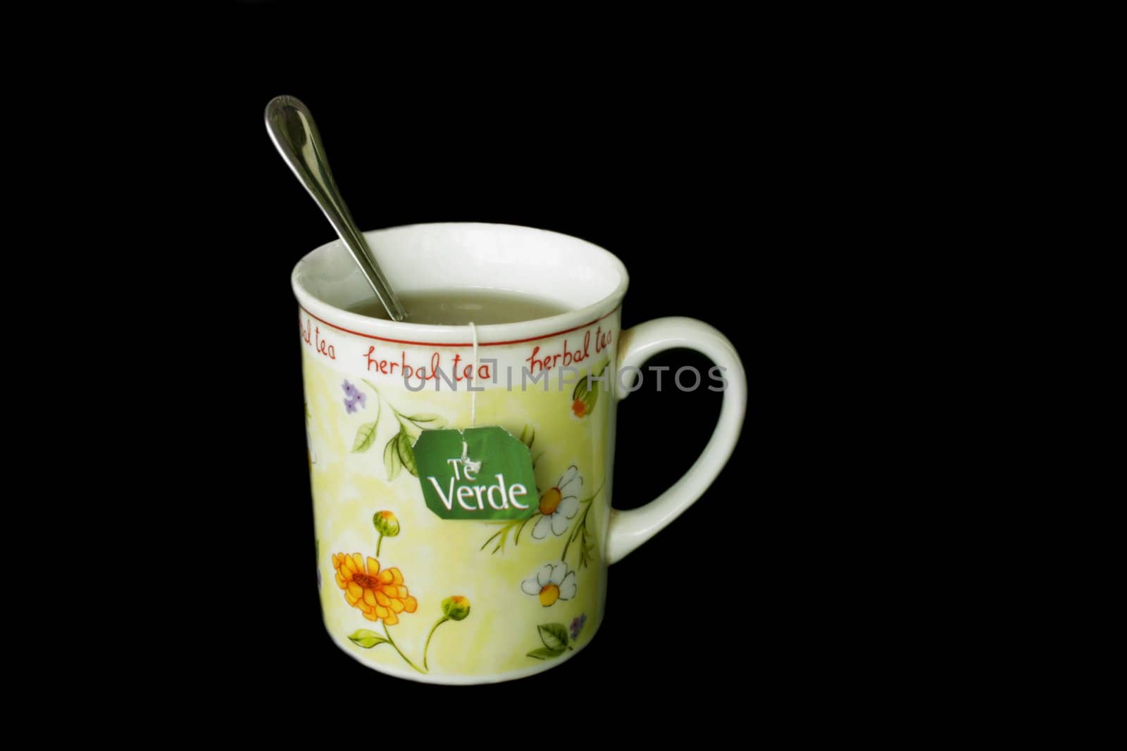 Green tea in china cup in isolated over black