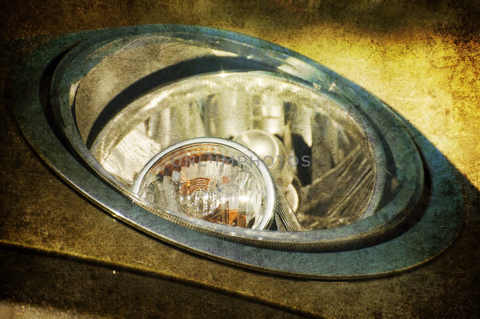 A grunge close up of an headlight
