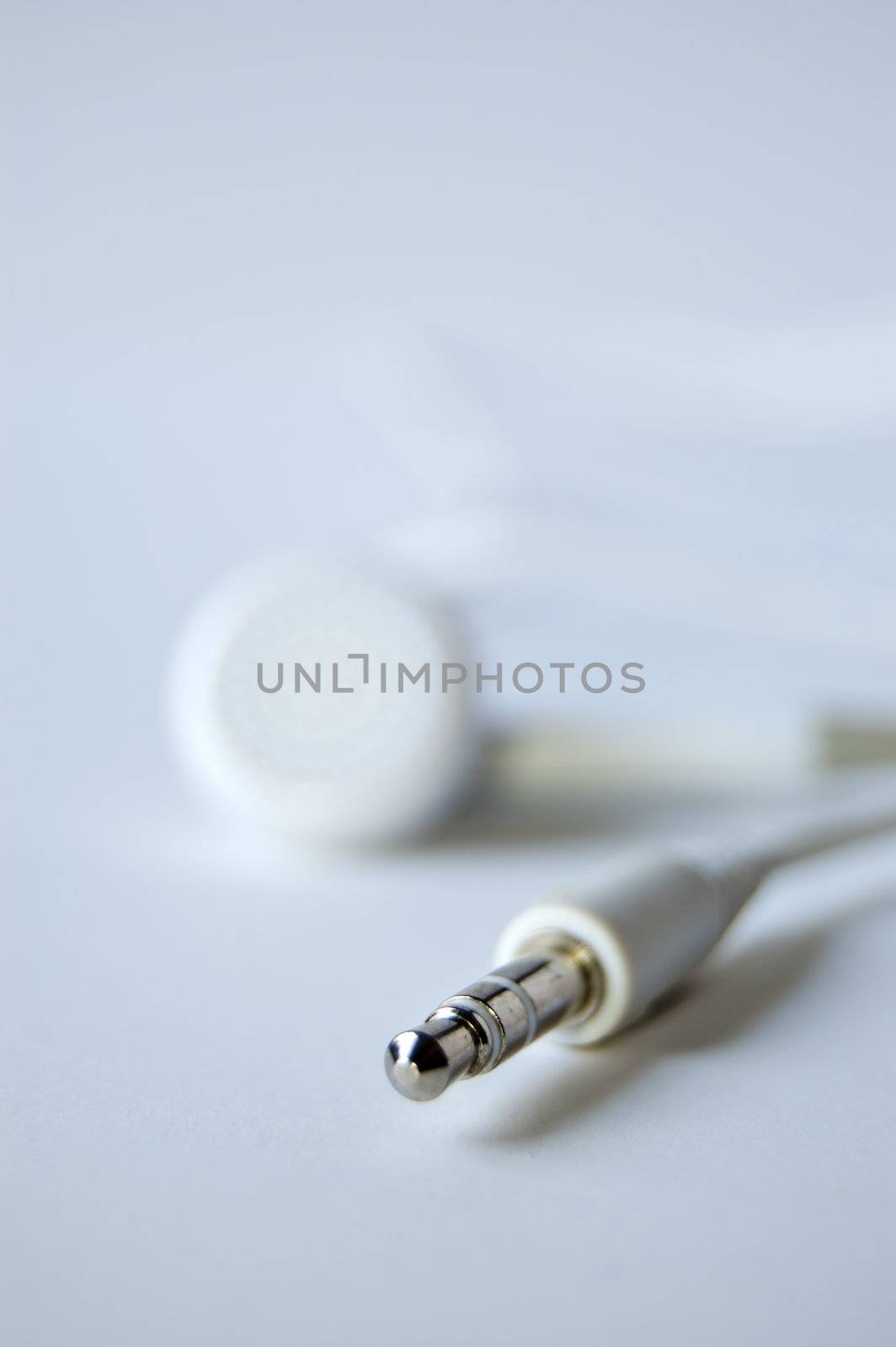 White headphones and his connector isolated on white