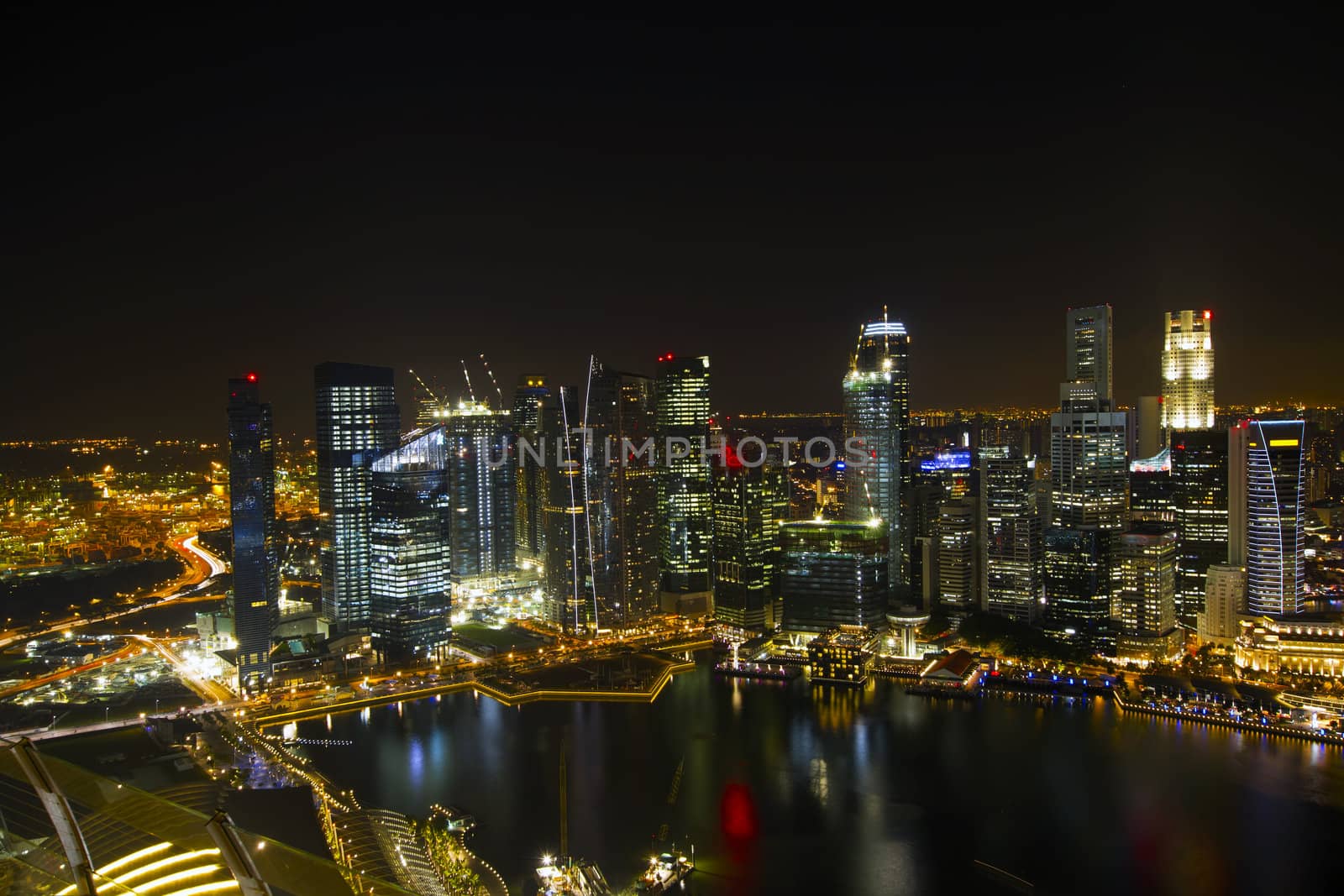 Singapore City Skyline by River at Night Aerial View