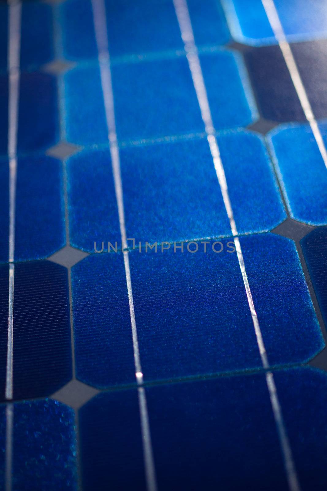 Pattern of solar cell wafers in photovoltaic solar panel with shallow DOF.