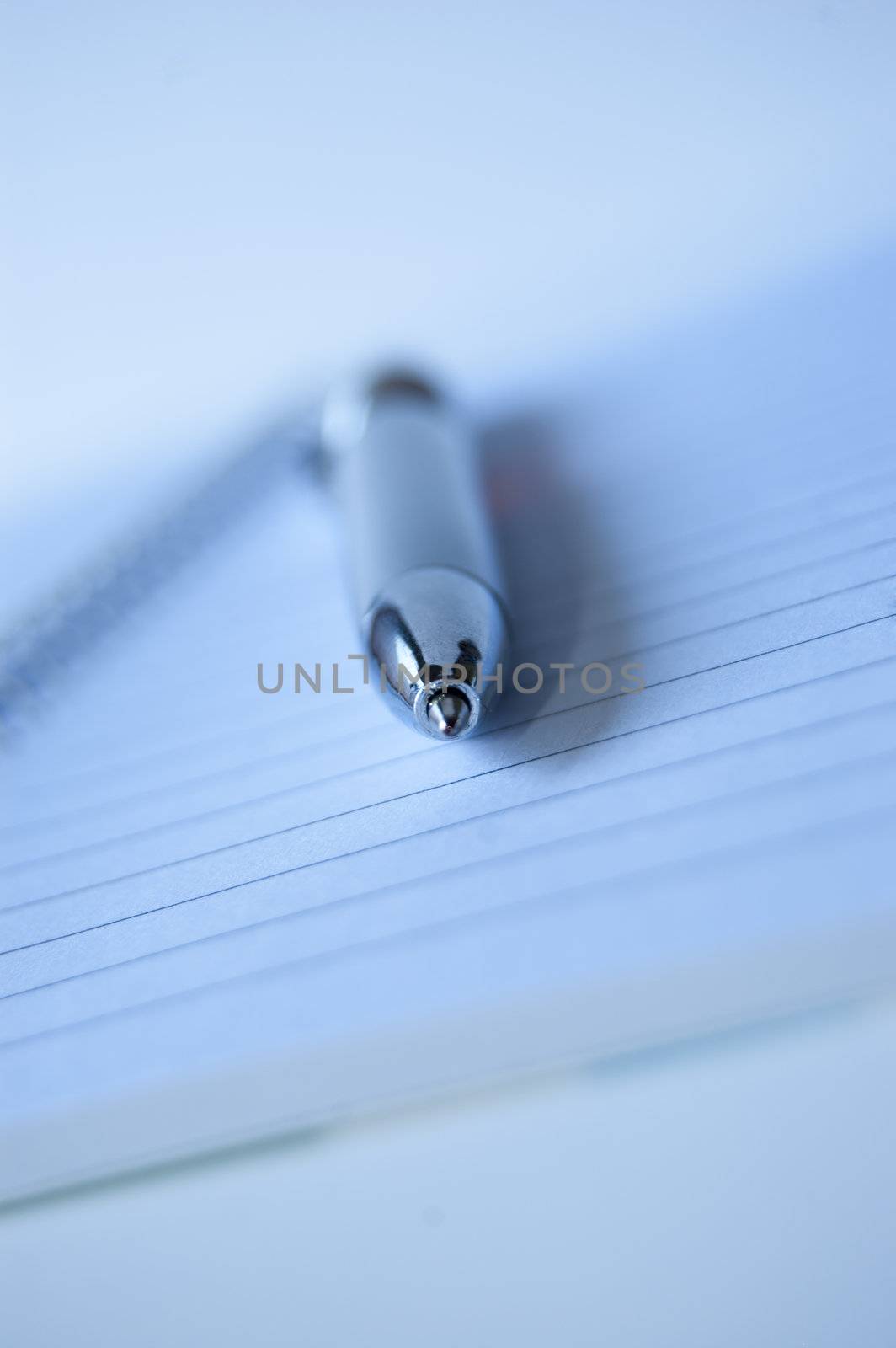 An elegant silver pen on a white book