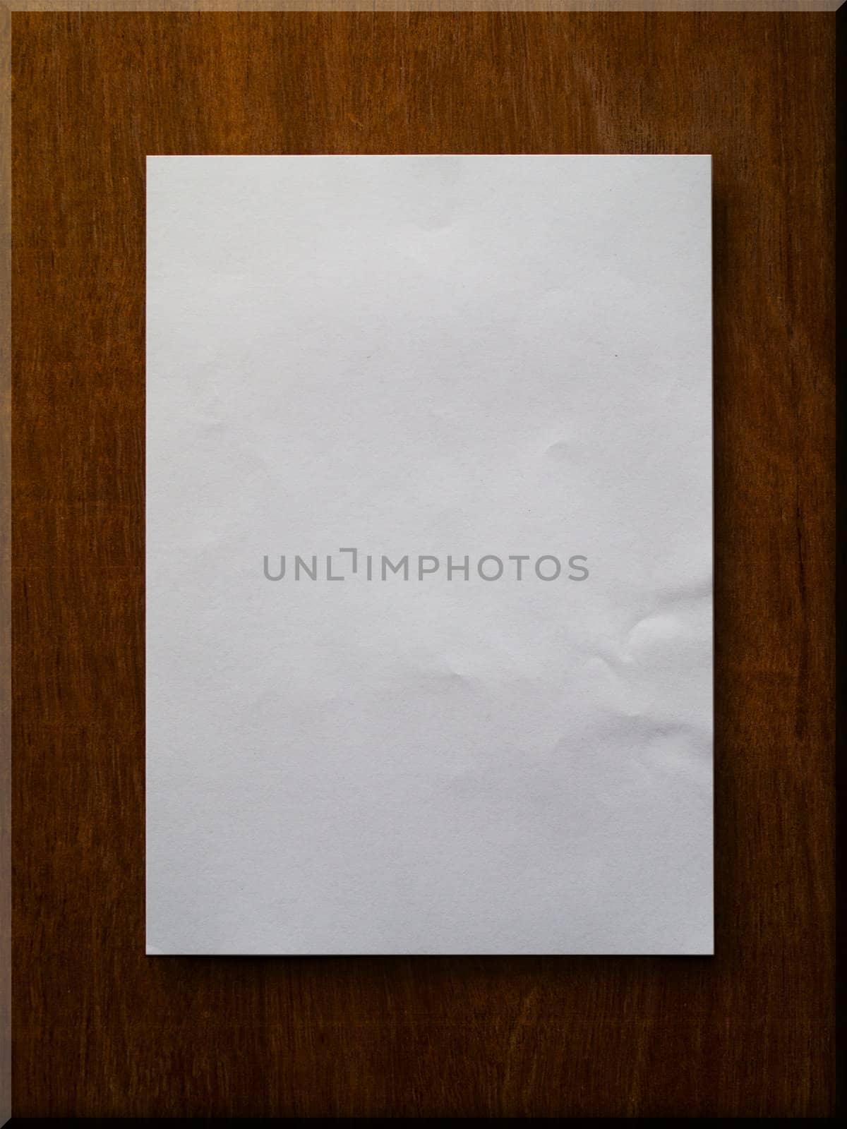 Blank paper on wood board background