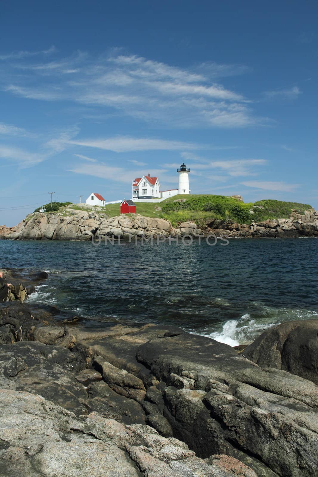 The Cape Neddick Nubble light house from a distance.