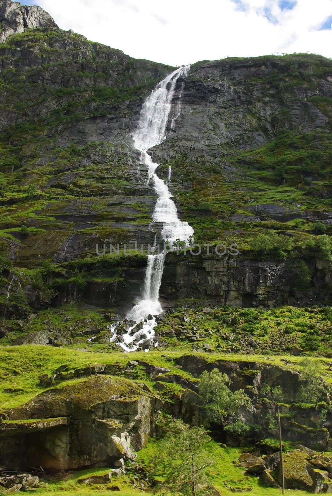 Mountain river with waterfall in Norway by Vitamin