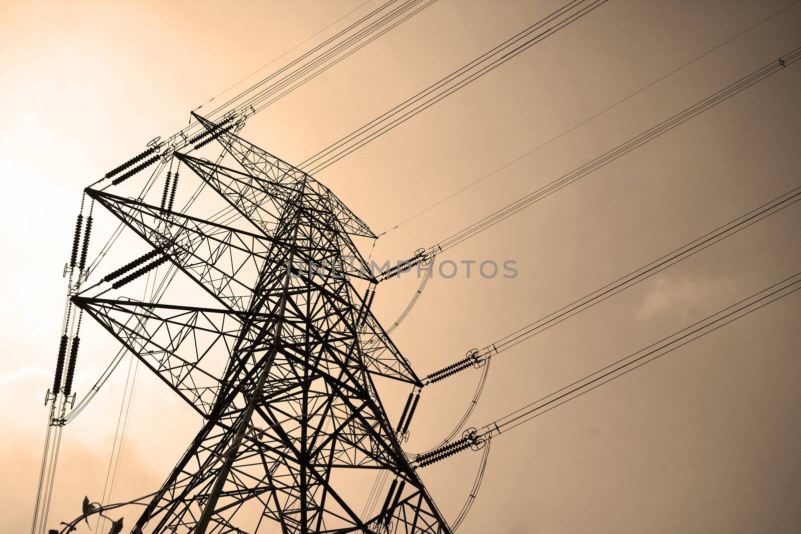 Electricity pylons with long cable at day