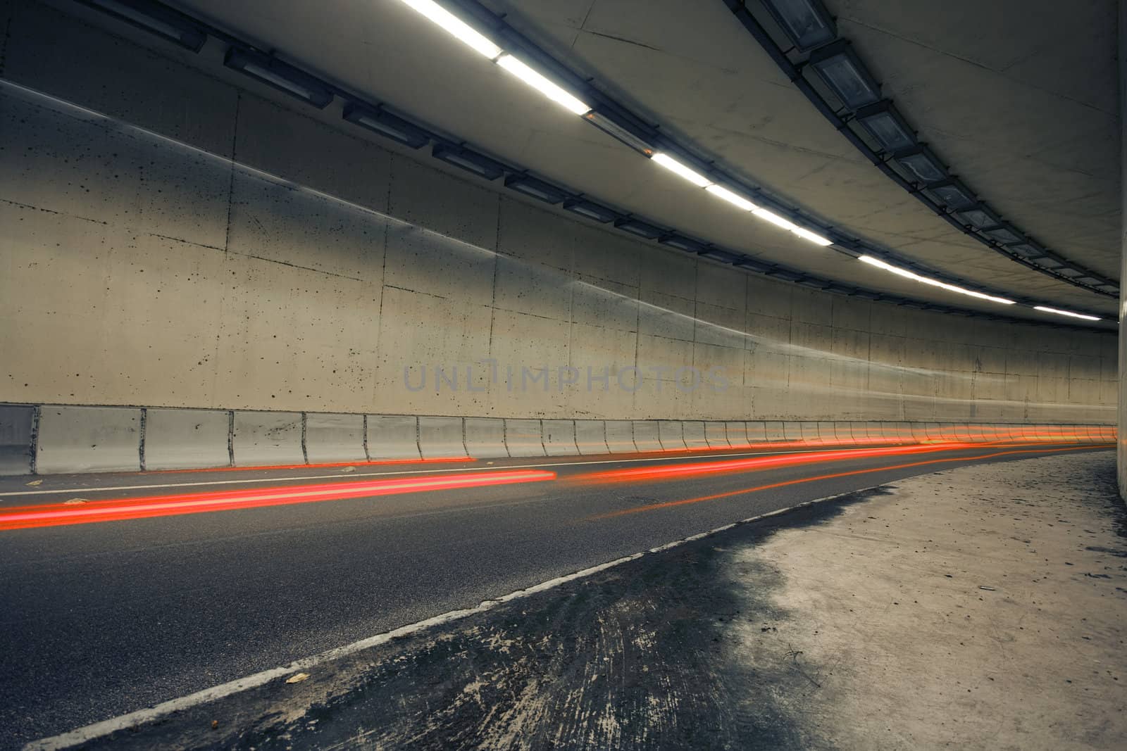 Car lights trails in a old tunnel 