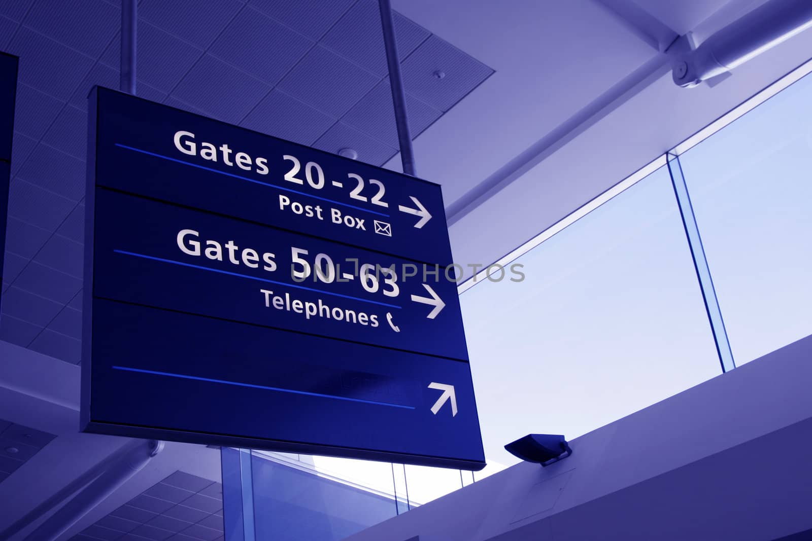 Airport Interior Architecture, Directions Sign And Glass Facade - Blue Toning