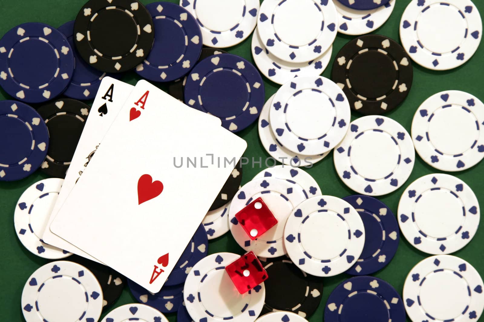 Casino Chips, Dice and Cards on Green Background