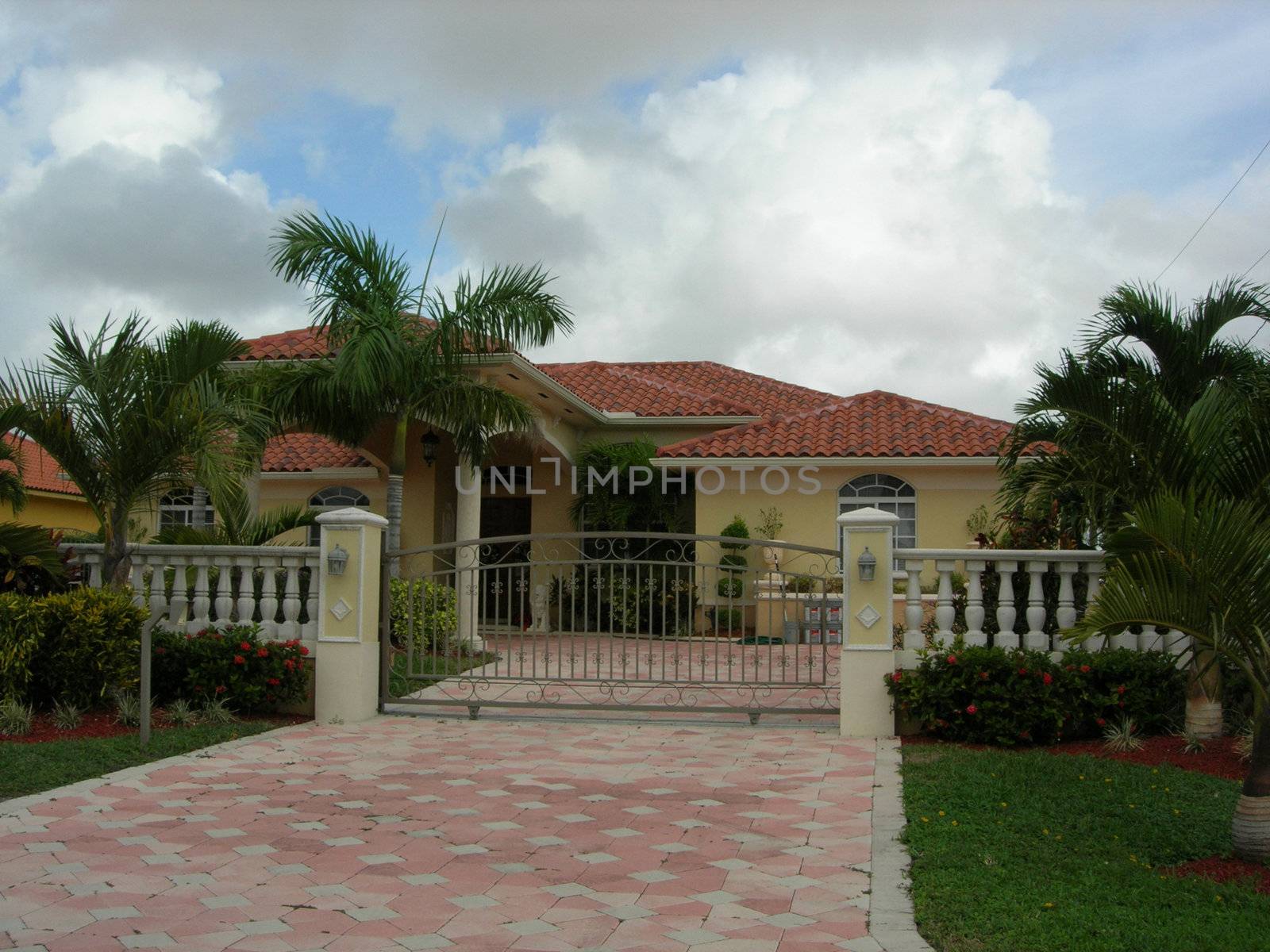Mediterrenean House With Colums, Iron Gate and Landscaping          