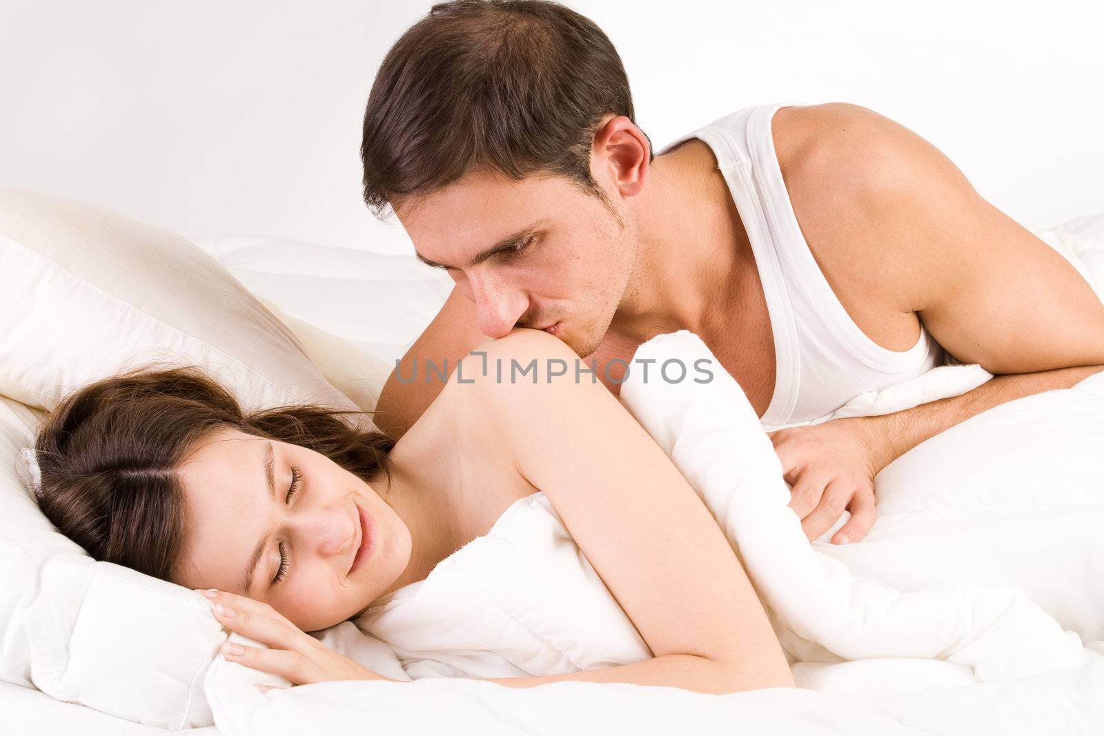 Young adult couple in the studio sleeping